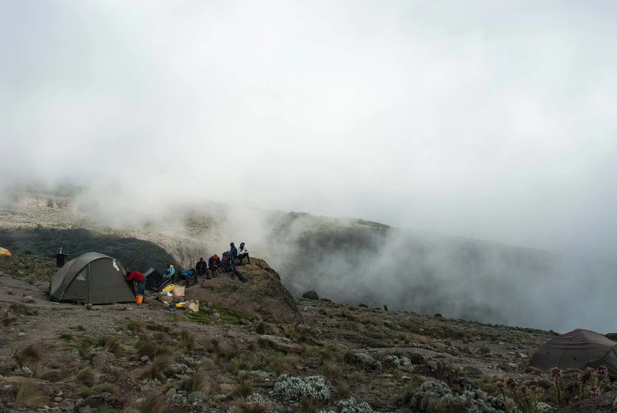 D5-16-porters-listening-to-soccer-on-a-rock-karanga-camp-kilimanjaro.jpg