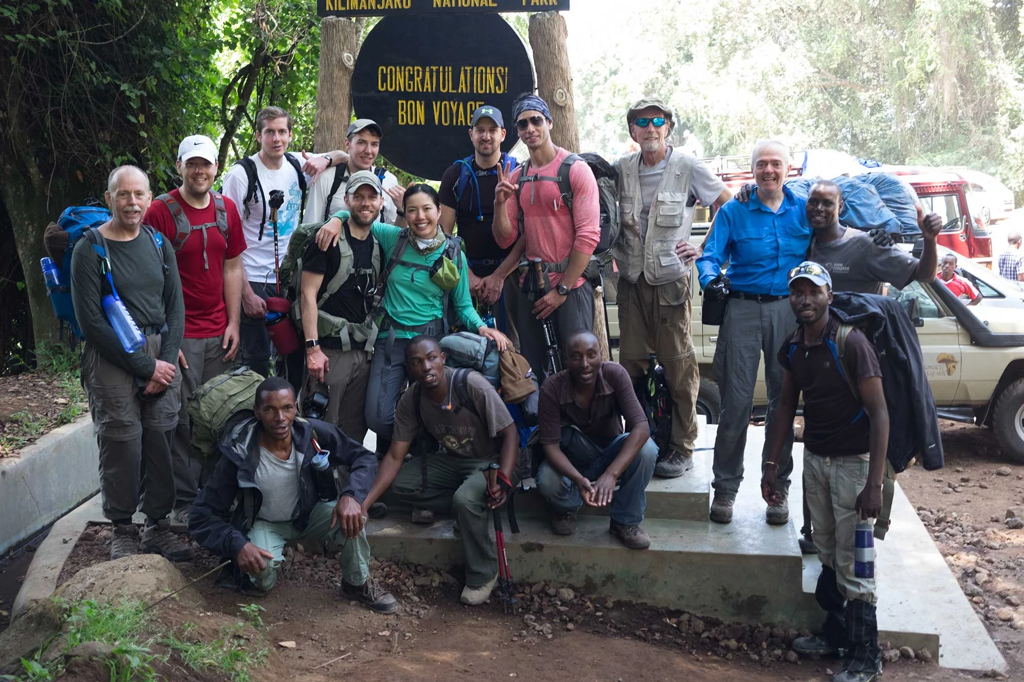 Climbers and guides celebrating a successful Kilimanjaro expedition.