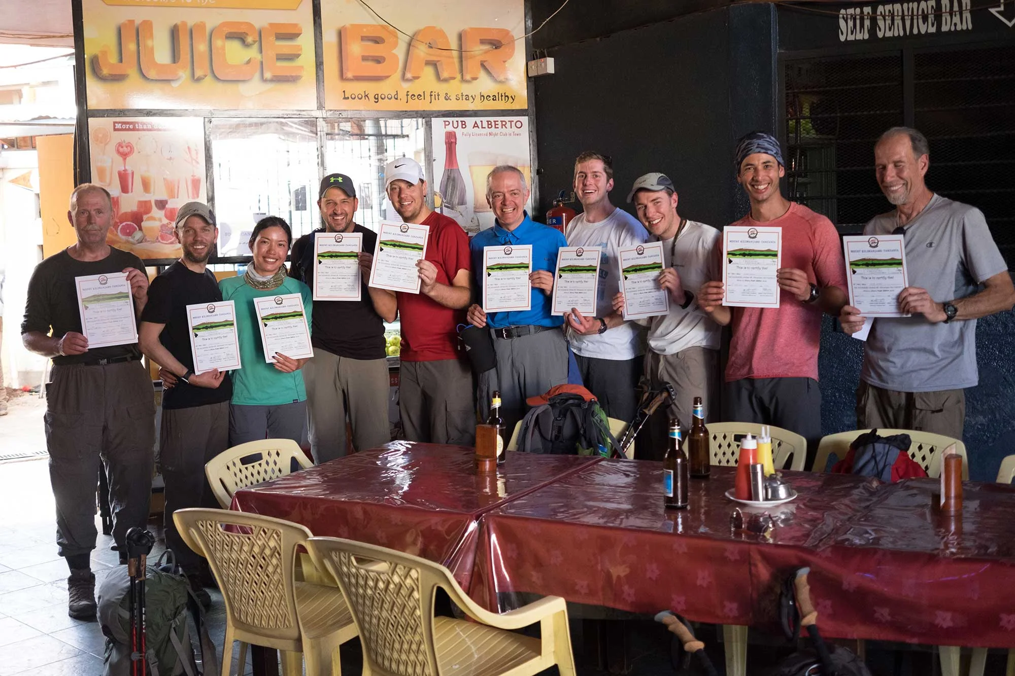 Ten happy Kilimanjaro climbers who all summited and descended safely.