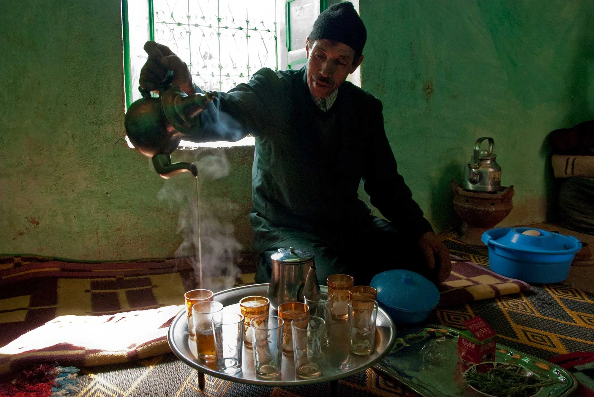 Our host pours mint tea for the group in the traditional way, allowing it to cool with the long pour.