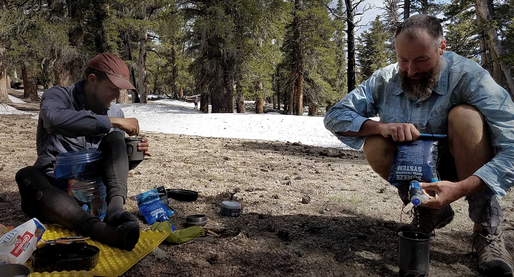 PCT hikers filtering water with Sawyer Squeeze filters. Photo by: Malin Klingsell
