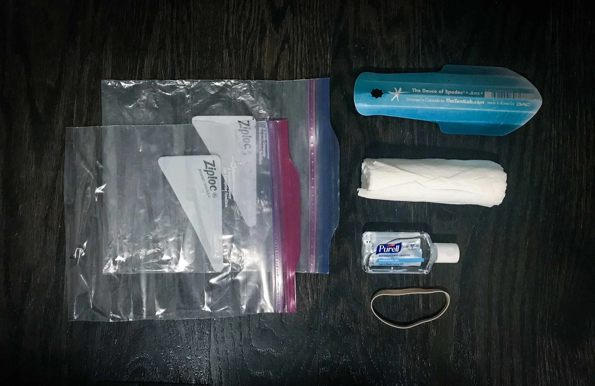 A standard Ultralight backcountry toilet kit. Some hikers opt to remove the trowel and dig with rocks, trekking poles, or their heels. I tried that once and ended up pooping next to the unfinished cat hole.
