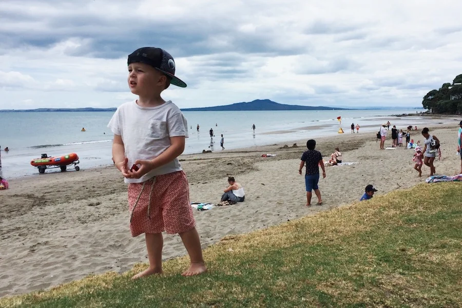 Finn (2) at Mairangi Bay Beach on New Year's Day