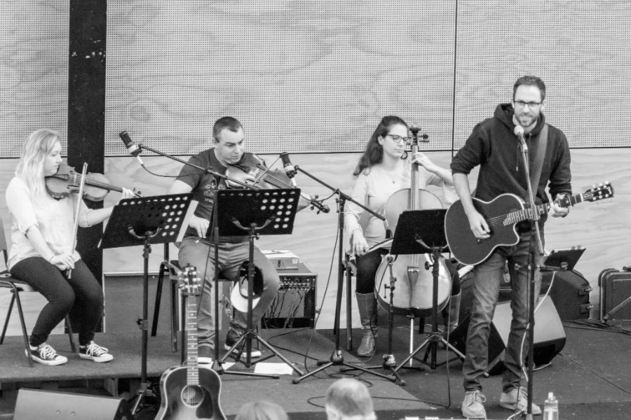 Nate and the strings section lead worship at Shore Community Church.