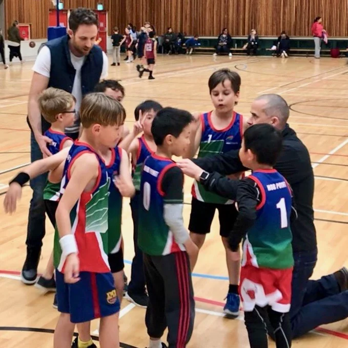 Nate and another dad coaching basketball