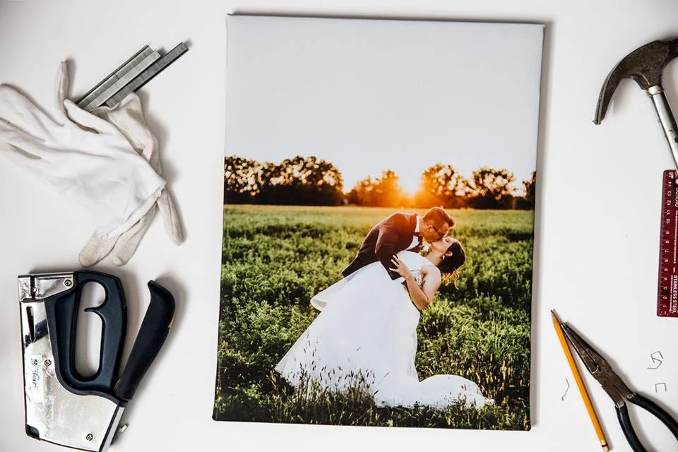 A wedding photo canvas wrap laid out with the tools used to stretch it, at Just Joy Imaging in Ottawa