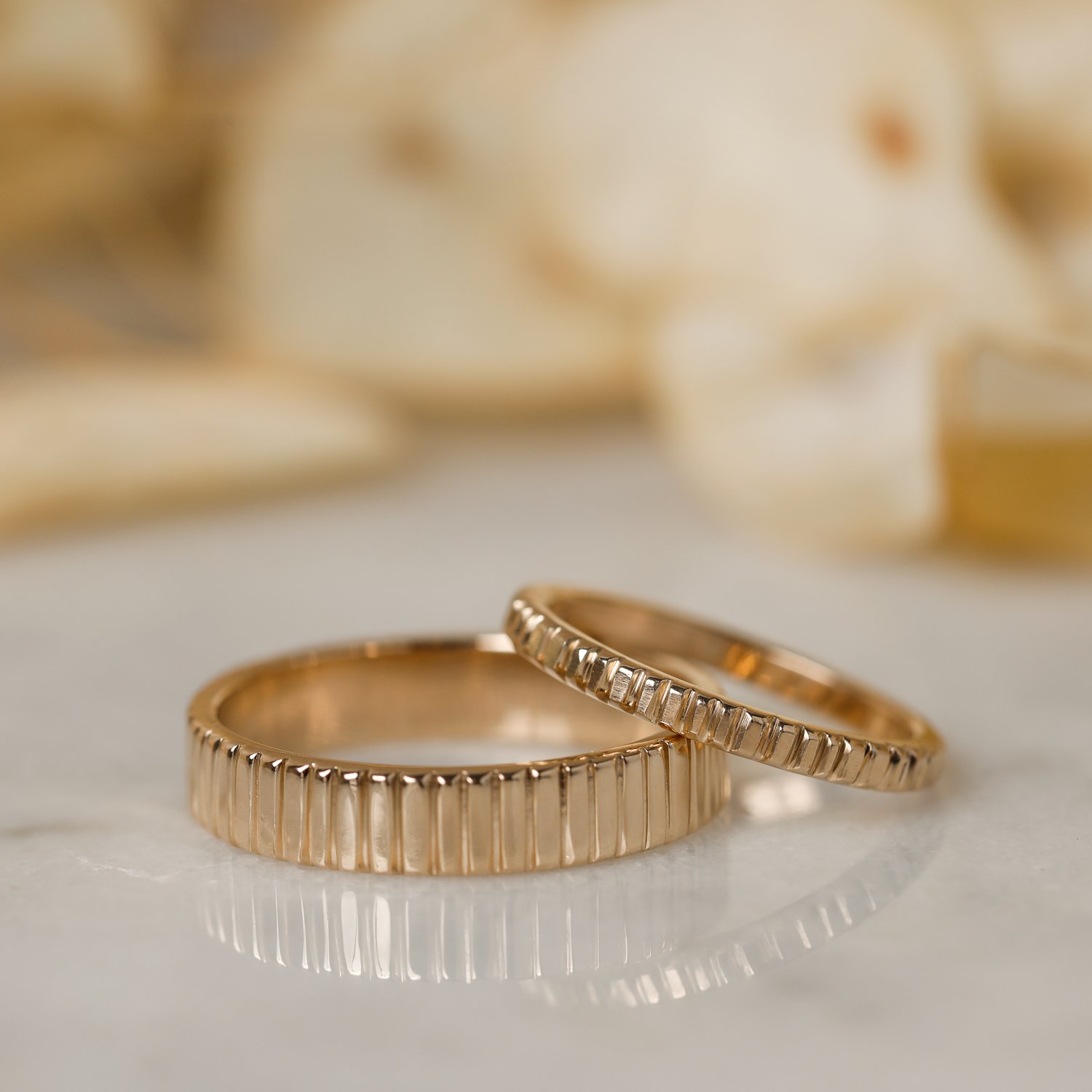 gold-striped-wedding-bands-styled.jpg