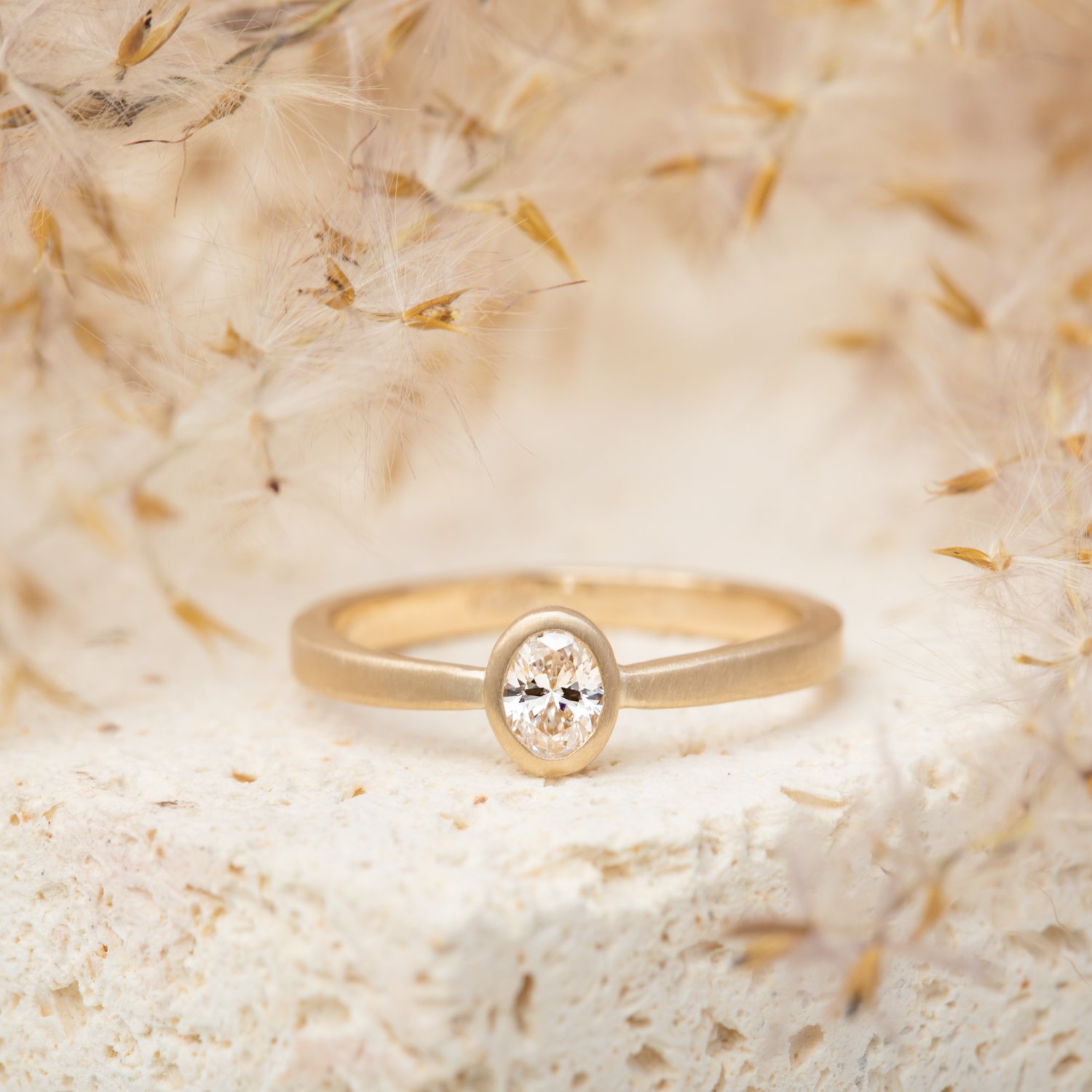 styled-oval-diamond-gold-ring.jpg