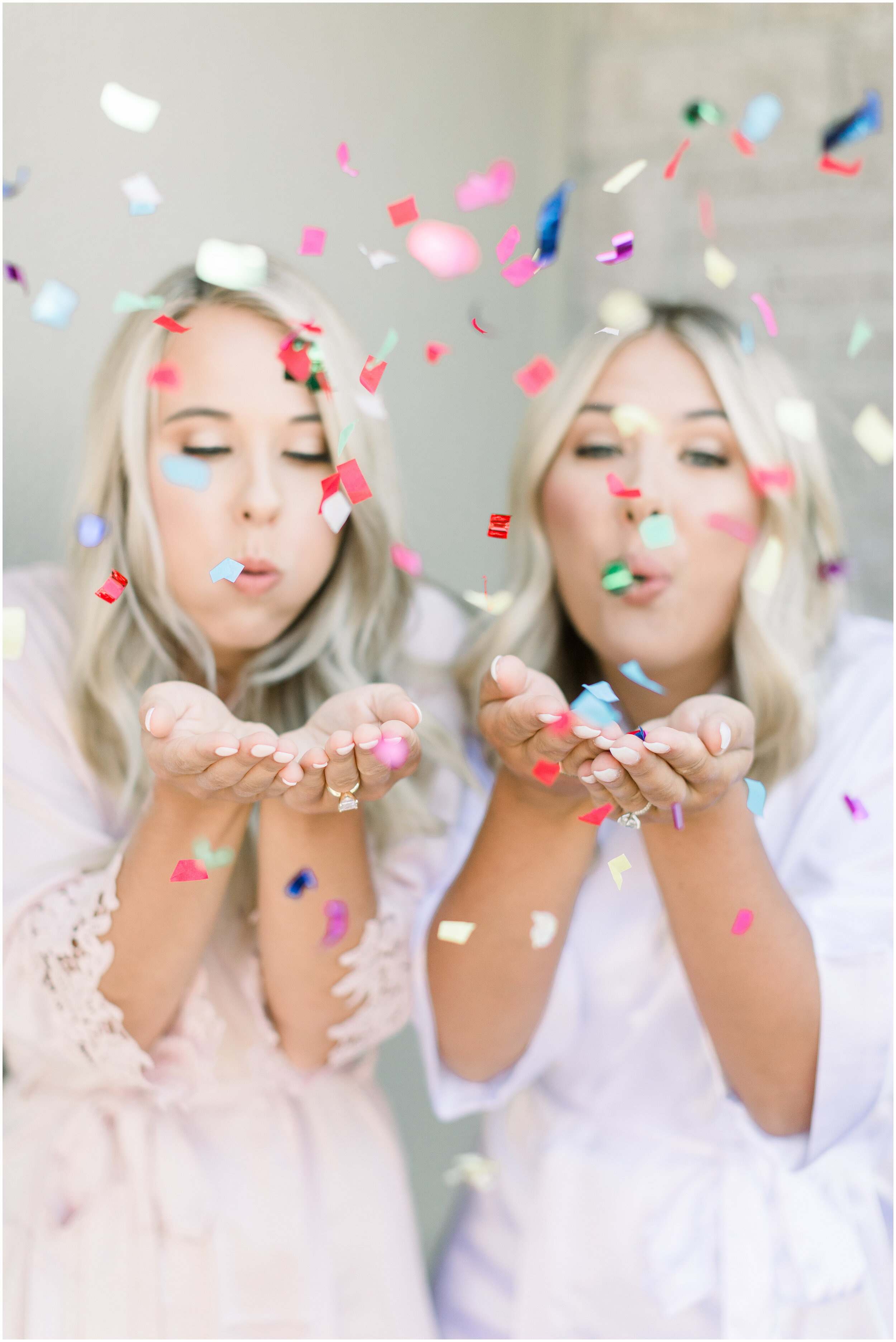  Bride and bridesmaid in silk robes with confetti in this boho wedding by Chelsea Mason Photography in Ottawa, ON. bridesmaid gifts bridesmaid robes bridesmaid mathcing robes outfit inspo confetti for wedding outdoor backyard wedding bridesmaid and b