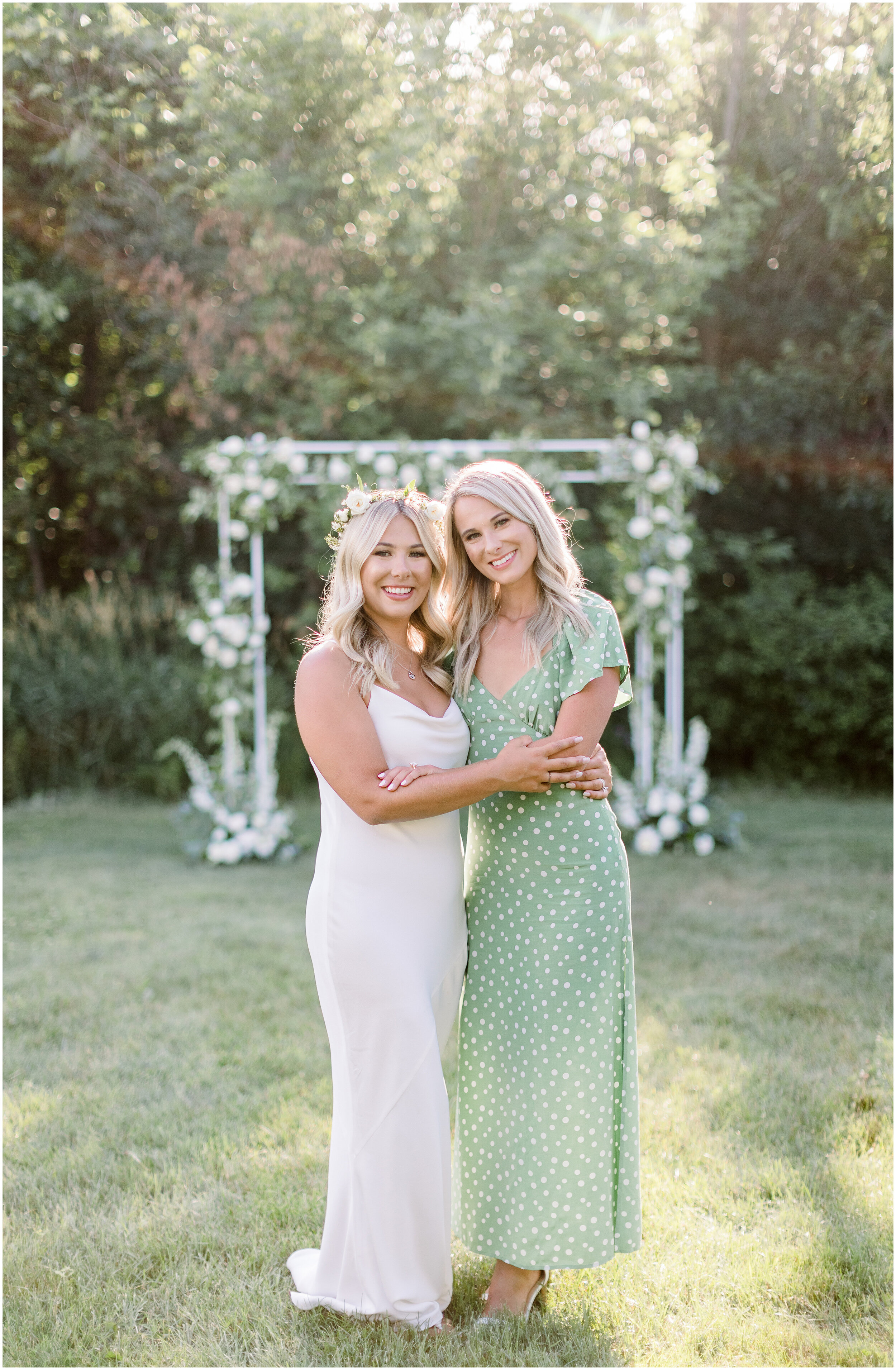  Bride and bridesmaid in green and white dress for white and green wedding colors in Ottawa, ON by Chelsea Morgan Photography. white and green wedding colors bridesmaid outfit ideas what color should my bridesmaid wear green bridesmaid dresses white 