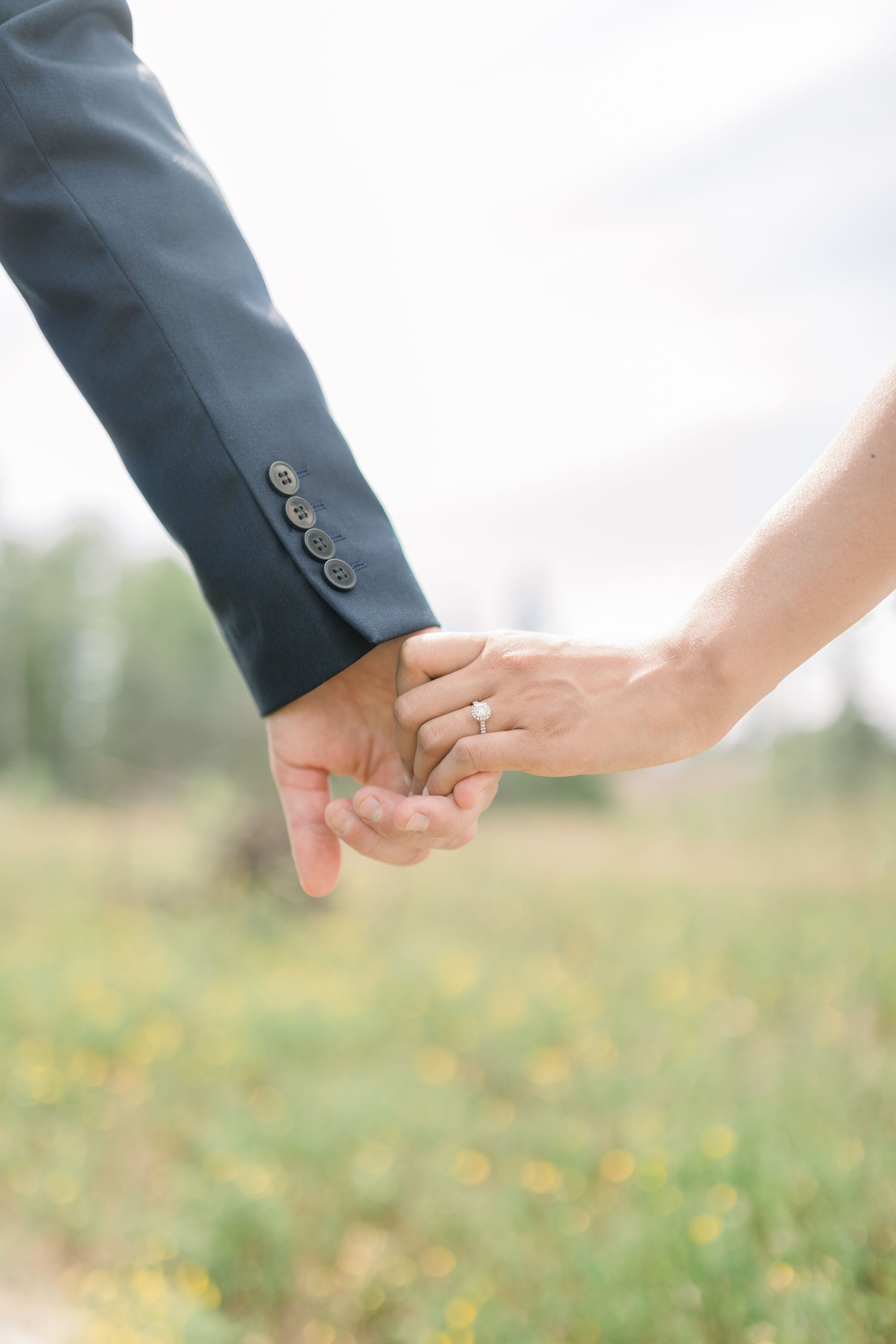  Detail shot of couple holding hands in bride and groom formals showing single diamond wedding ring in Ottawa, ON by Chelsea Mason Photography. single diamond wedding rings wedding ring inspo simple wedding rings princess cut diamond rings wedding ph