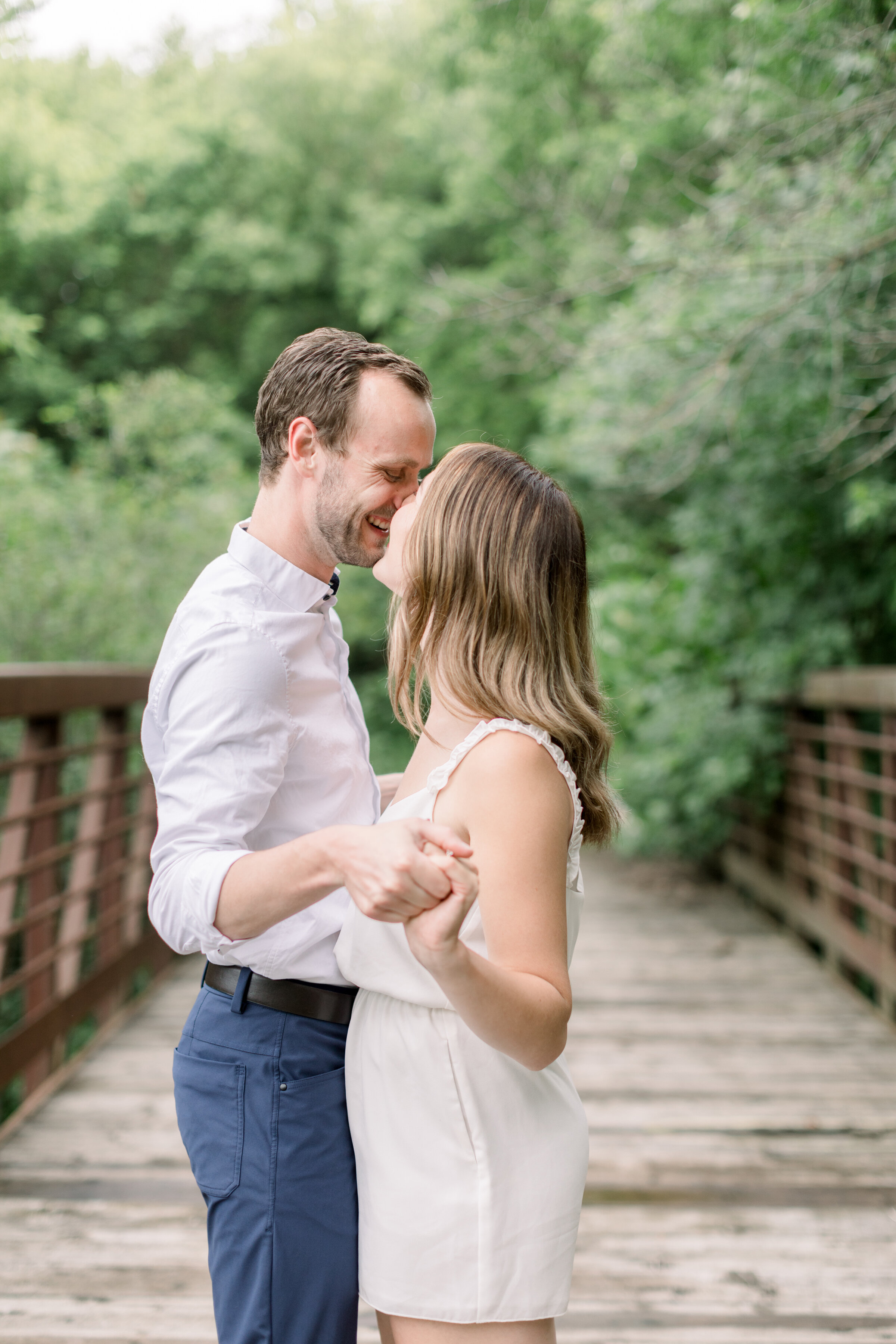  Chelsea Mason Photography shows the perfect engagement photography session on a bridge in Ottawa, ON. summer photoshoot locations outdoor photography locations best places to take engagements in ottawa kingston wedding photographer best wedding phot