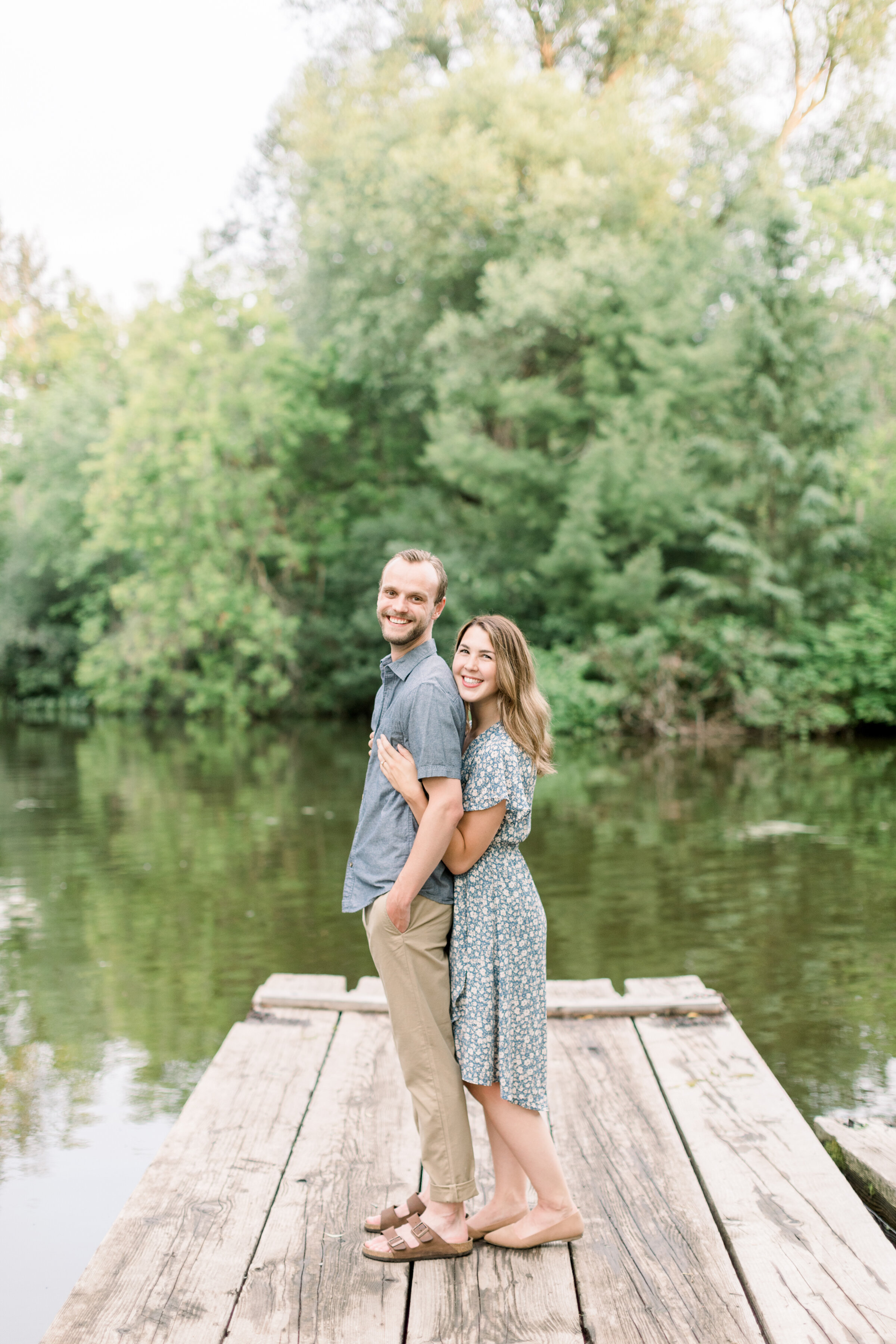  Beautiful couple in perfect engagement photoshoot location on a wood dock by a beautiful lake by Chelsea Mason Photography in Ottawa, ON. lake locations for photoshoot best wedding photographer in ottawa lake photoshoot locations places with docks f