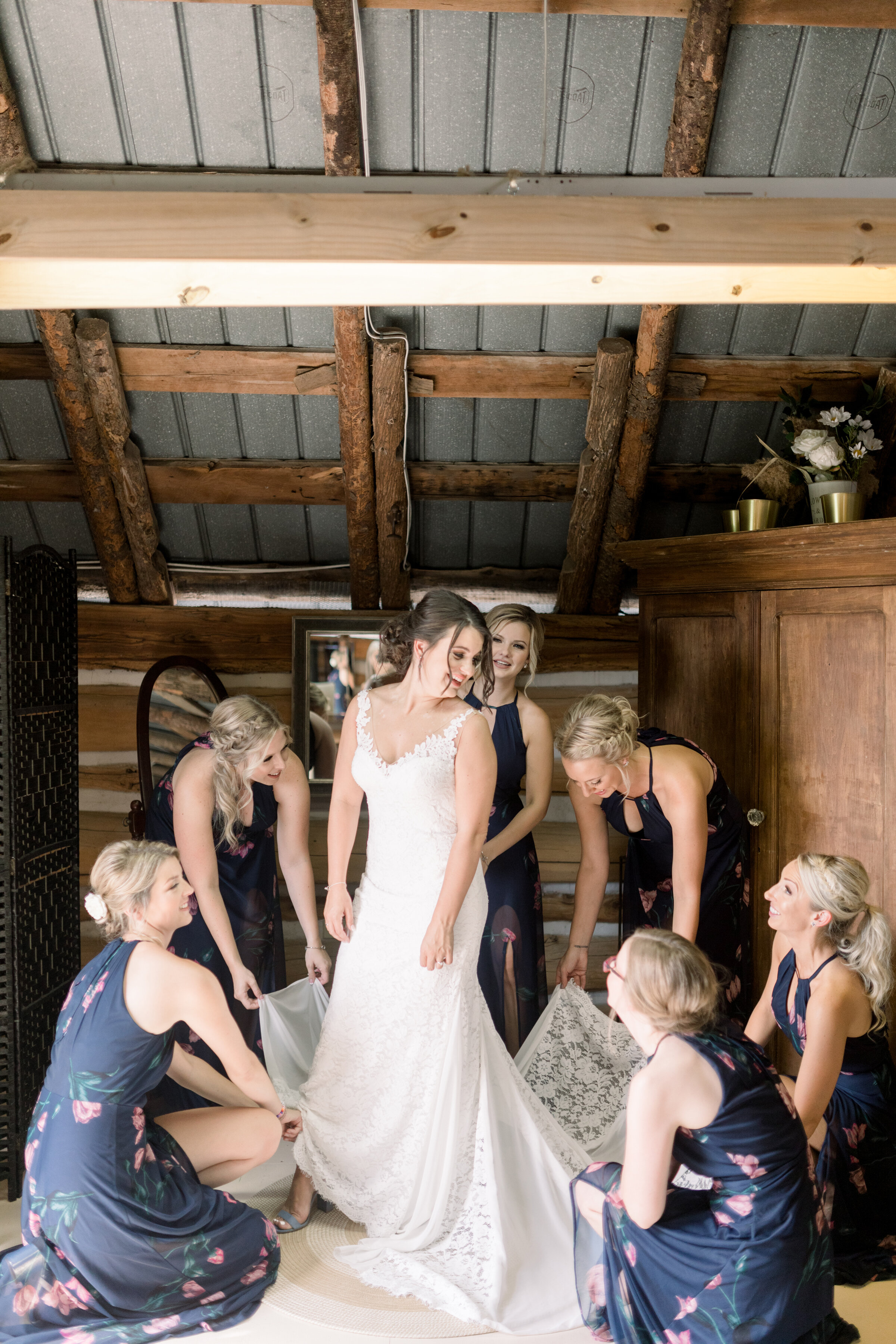  Beautiful bride with her bridal party all wearing blue dresses with a floral pattern and bride has blue shoes as an accent wedding color by Chelsea Mason Photography. ottawa on best wedding photograph in ottawa how to dress your bridal party blue we