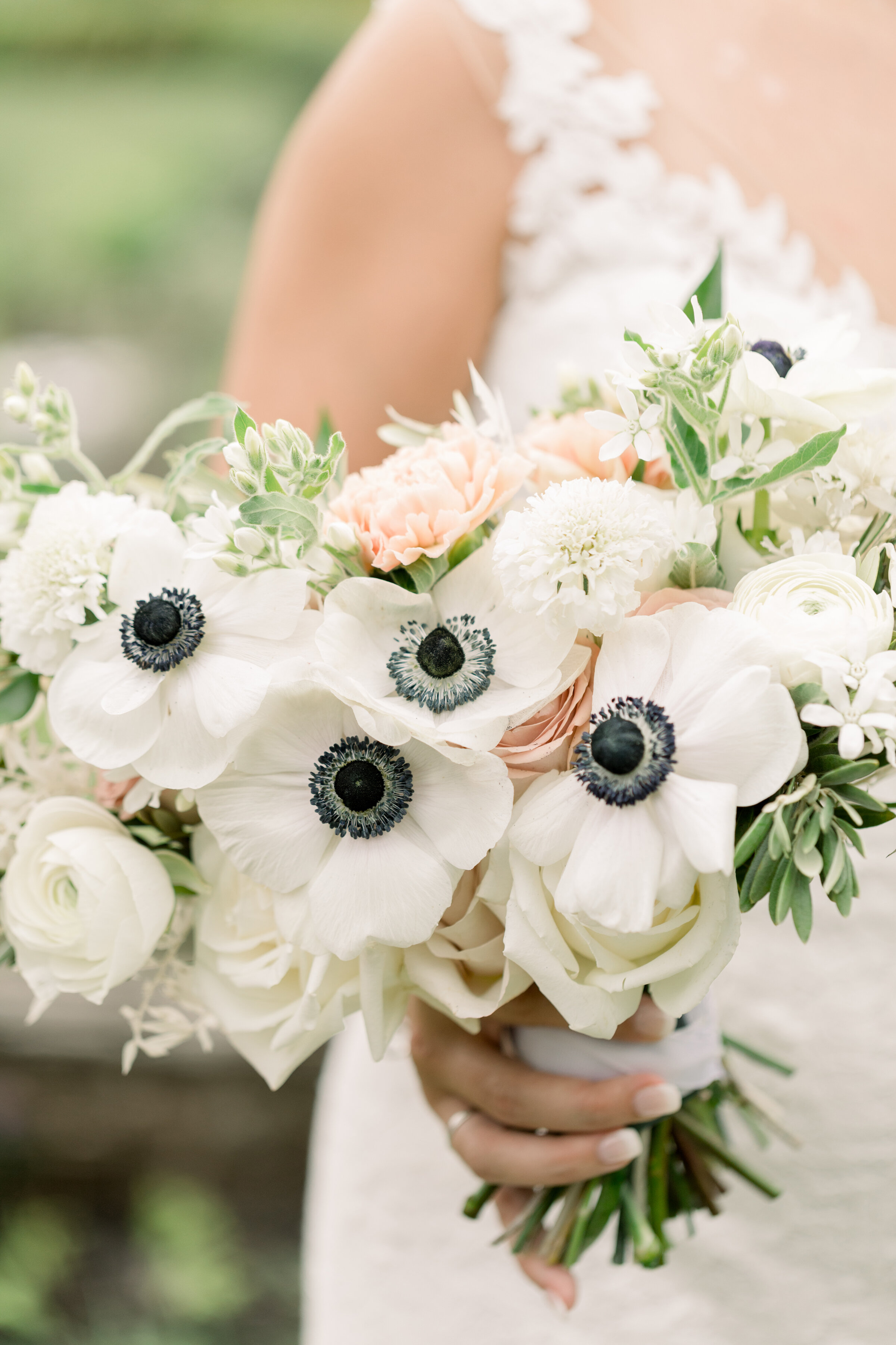  Detail shot of bridal bouquet with white and black and blush flowers by Chelsea Mason Photography in Ottawa, ON. best wedding photographer ottawa white black blue blush wedding colors unique bridal bouquets how to arrange a bridal bouquet wedding fl