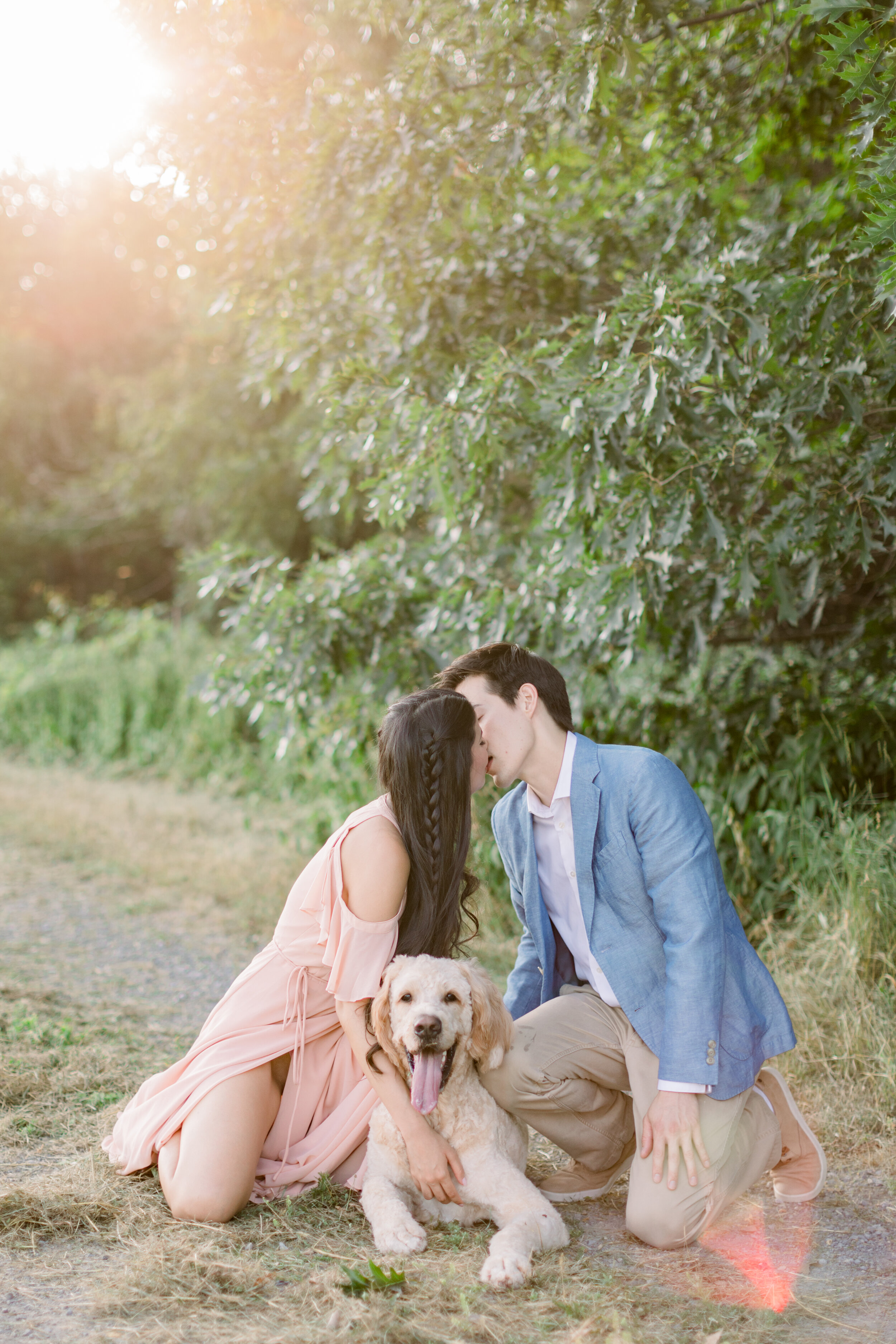  Engagement photo sessions with couple wearing pink and blue and posing with their dog by Chelsea Mason Photography in Ottawa, ON. couple outfit inspo for summer engagements dog poses for engagements doing engagements with your dog photographing dogs