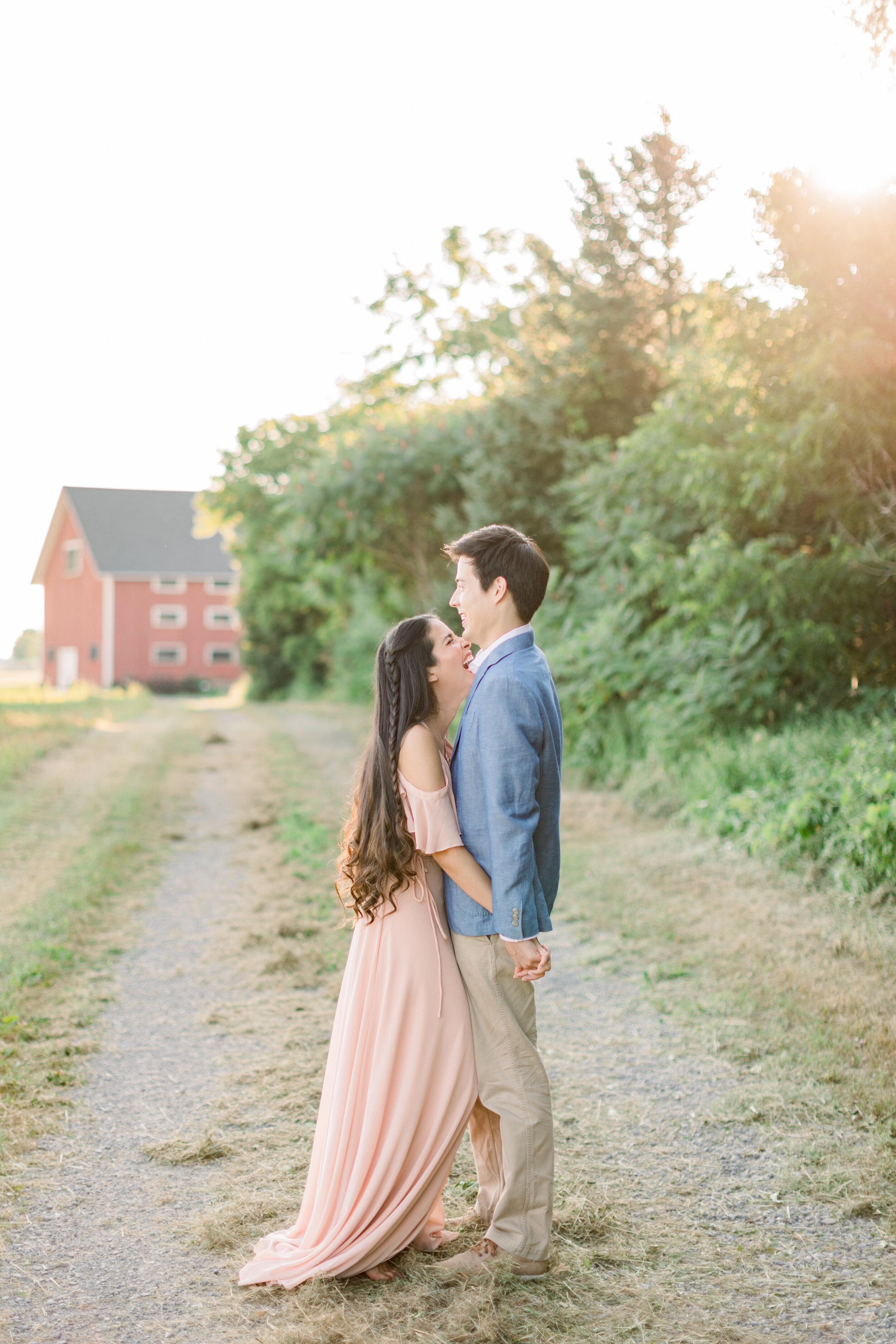  Gorgeous couple with bride-to-be wearing blush flowing pink dress and long brown hair with a braid by Chelsea Mason Photography. ottawa wedding photographer best wedding photographer in ottawa blush dress for engagements wearing pink in engagements 