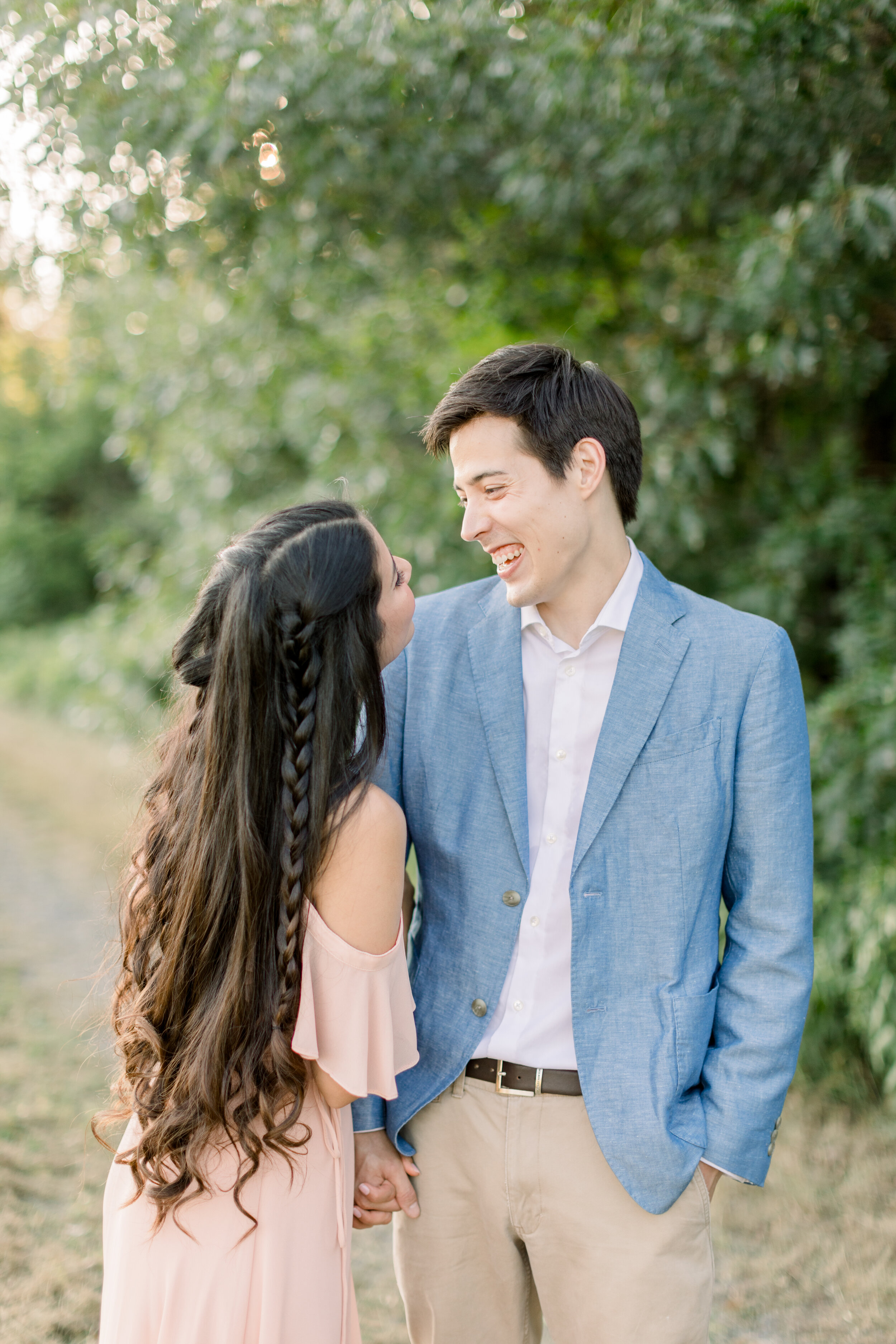  Gorgeous bride-to-be with very long brown hair that is curled and in braids for engagement photoshoot by Chelsea Mason Photography in Ottawa, ON. hair inspo for engagements how should i style my hair for engagements doing your hair for engagements e
