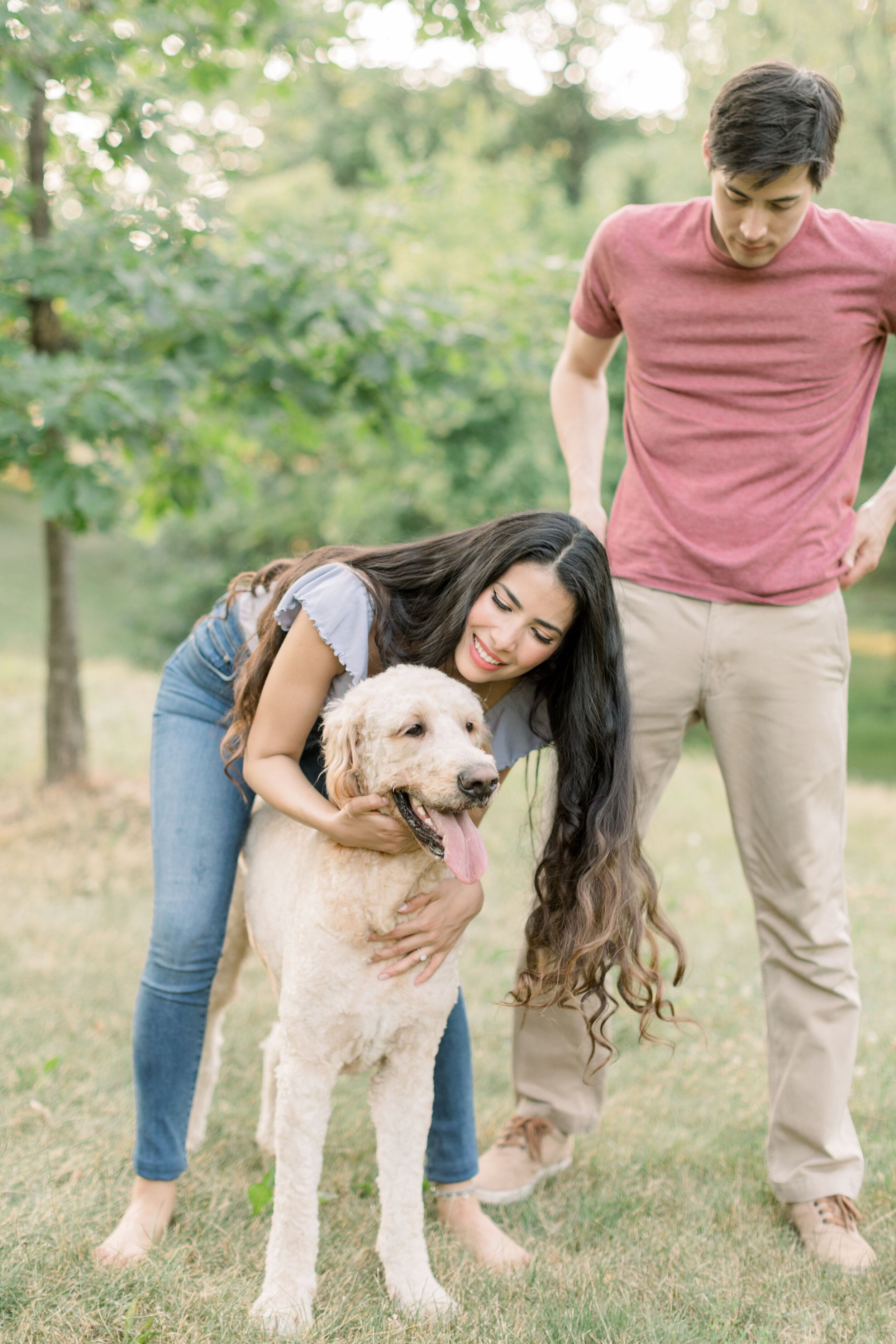  Adorable couple taking engagements with their dog wearing casual clothes in jeans and shirt in Ottawa, ON by Chelsea Mason Photography. dressing casual for engagements casual outfit inspo for engagements best outfits for engagements jeans for engage