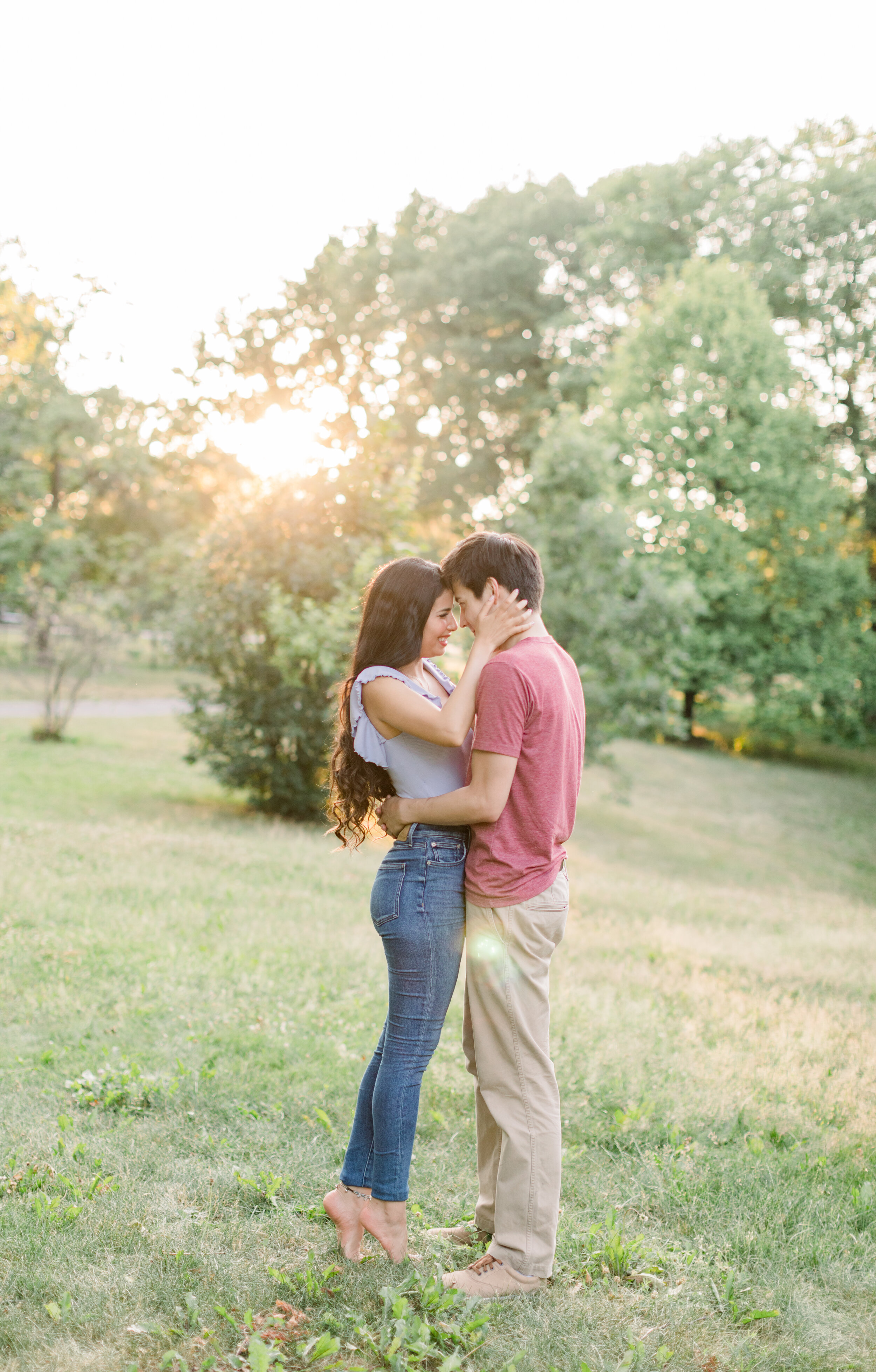  Beautiful couple wearing jeans and a rib-knit blue tee and khakis and a red shirt for outfit inspo in engagements by Chelsea Mason Photography. how to dress for engagements blue and red for engagements summer colors for engagements how should we dre
