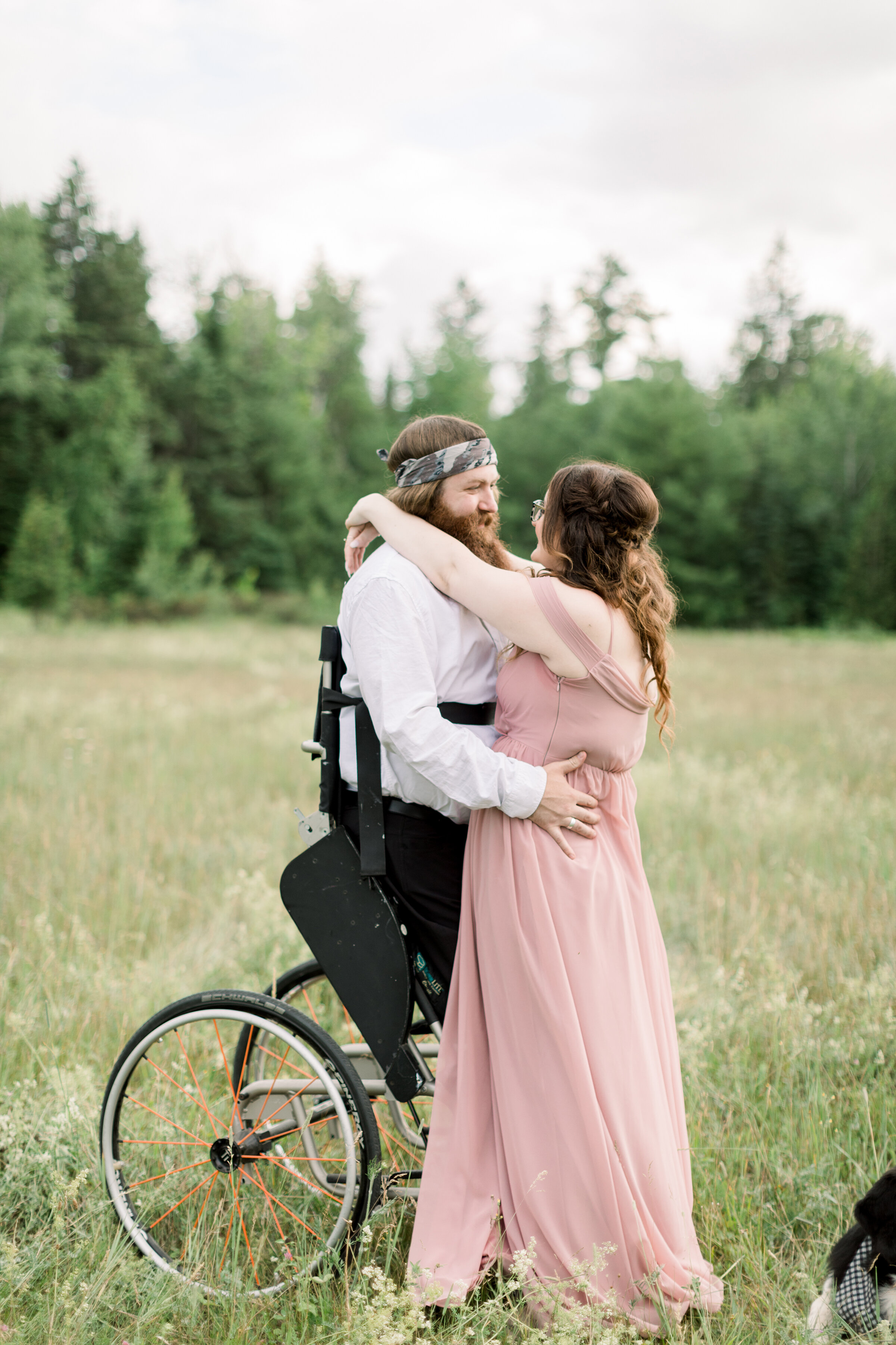  An amazing couple hug for the first time standing up in a beautiful engagement session by Chelsea Mason Photography. Capturing the forever moments couple goals standup chair dusty rose flowing dress engagement attire inspiration ideas and goals outd