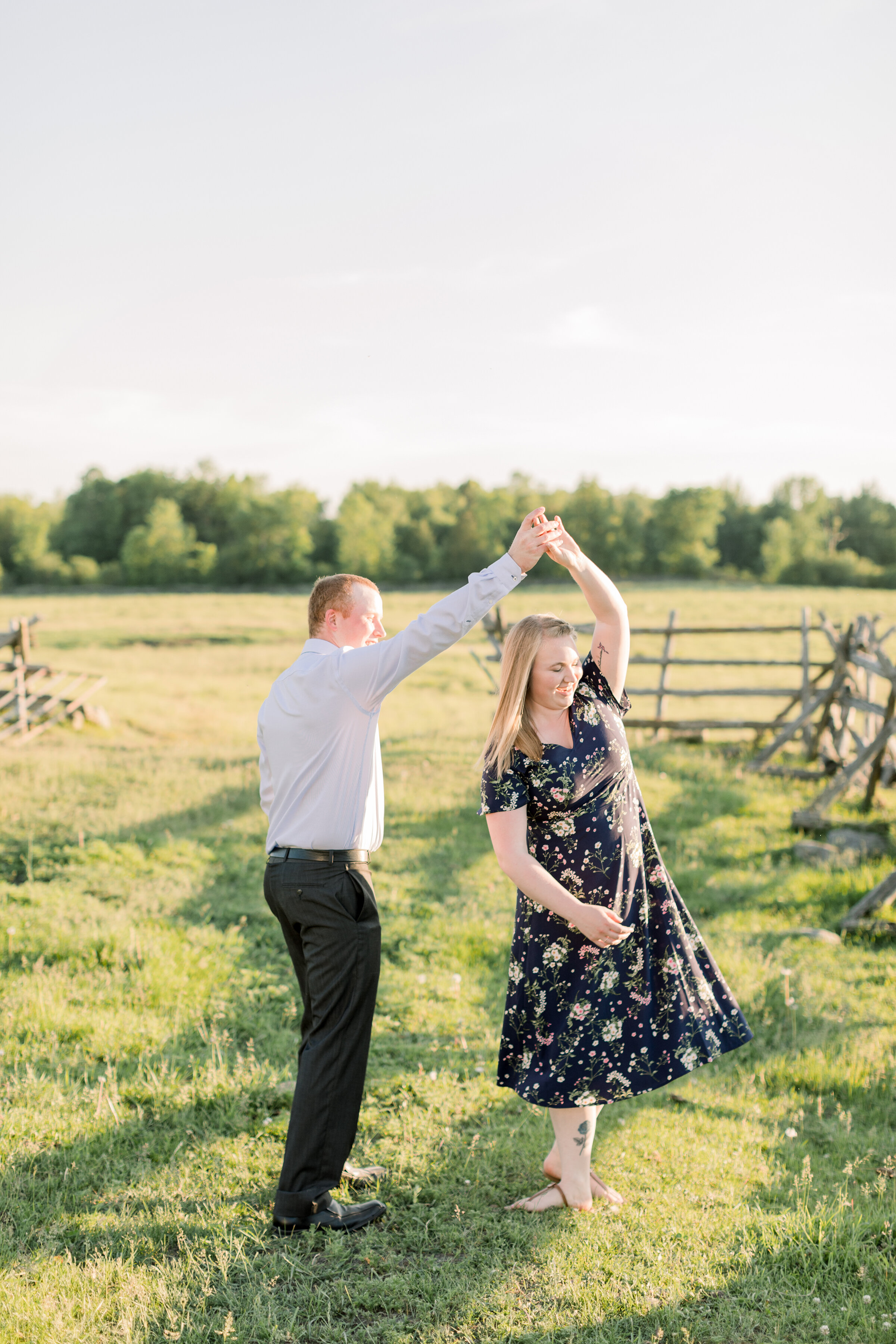  A couple dance in the fields in a bright and airy engagement session by professional engagement photographer Chelsea Mason Photography. Outdoor engagement session inspiration ideas and goals for country brides semi formal attire women’s sundress ins