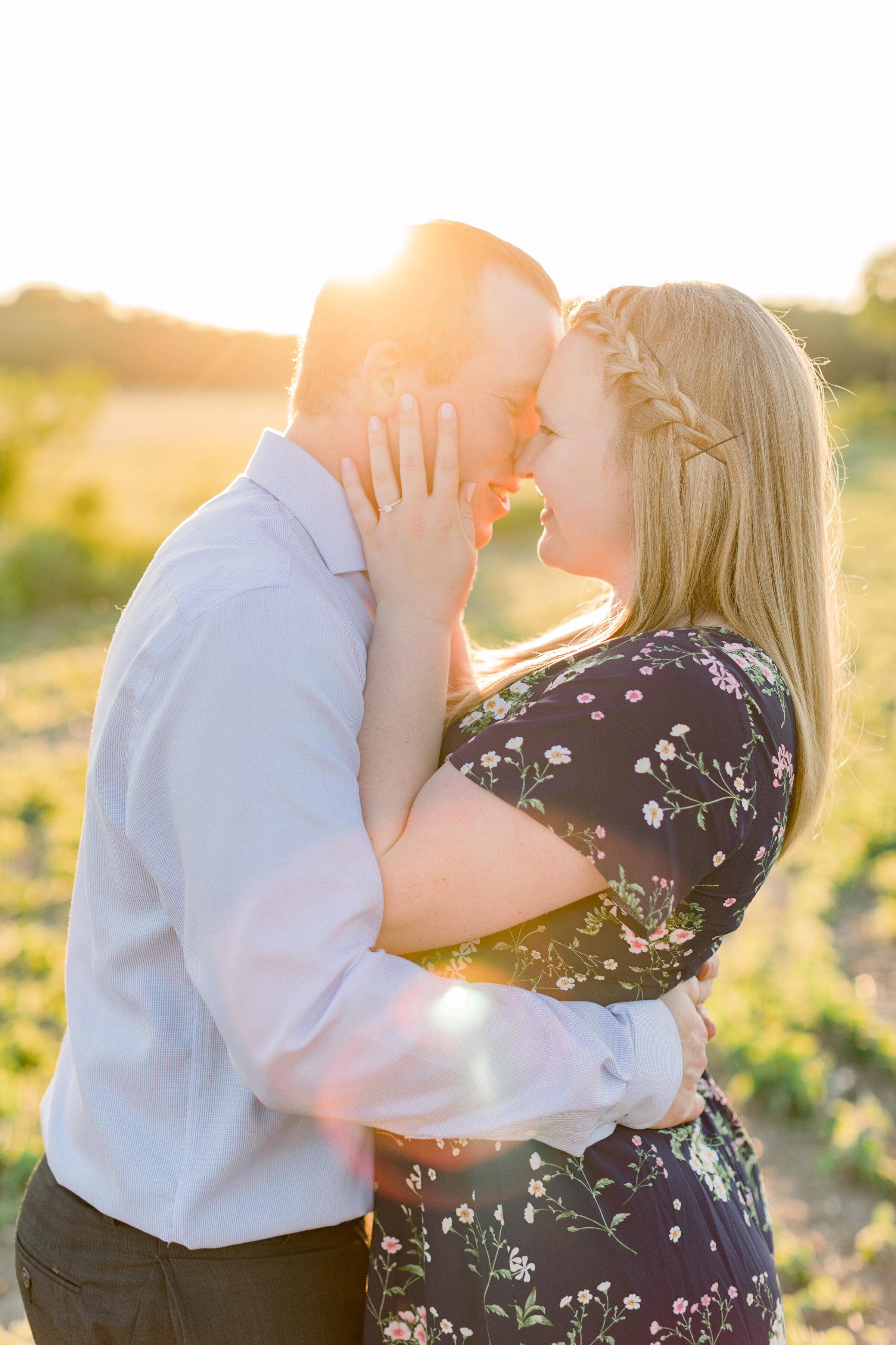  A romantic kiss between husband and wife in a beautiful engagement session on the farm by Chelsea Mason Photography. Summer engagement session inspiration ideas and goals couple goals couple pose inspiration client attire inspiration for semi formal