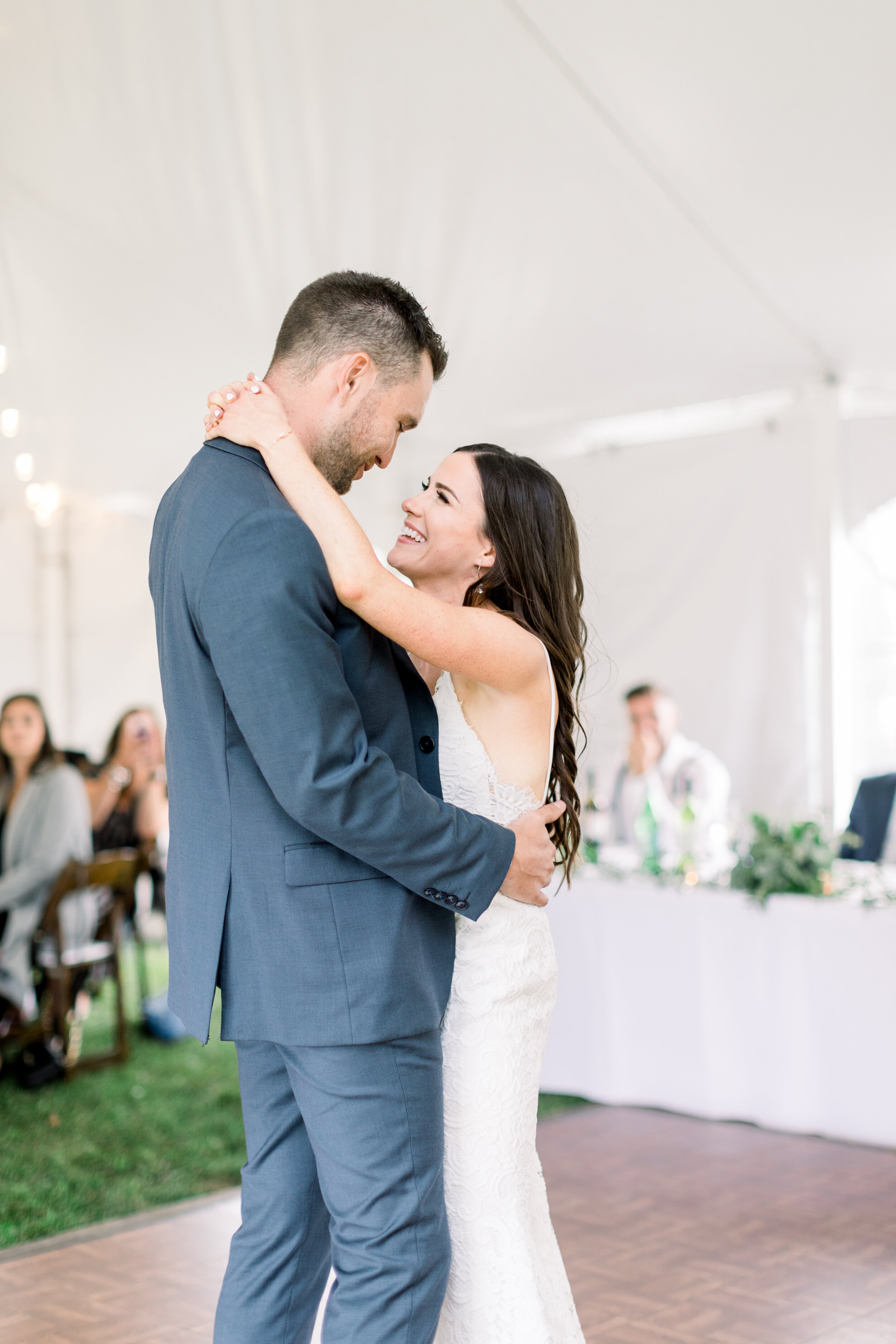  The first dance as husband and wife in this gorgeous backyard wedding in Ottawa, Ontario with Chelsea Mason Photography. Happy smiles bride and groom husband and wife white wedding dress navy blue wedding suit attire Fenelon Falls ontario wedding ph