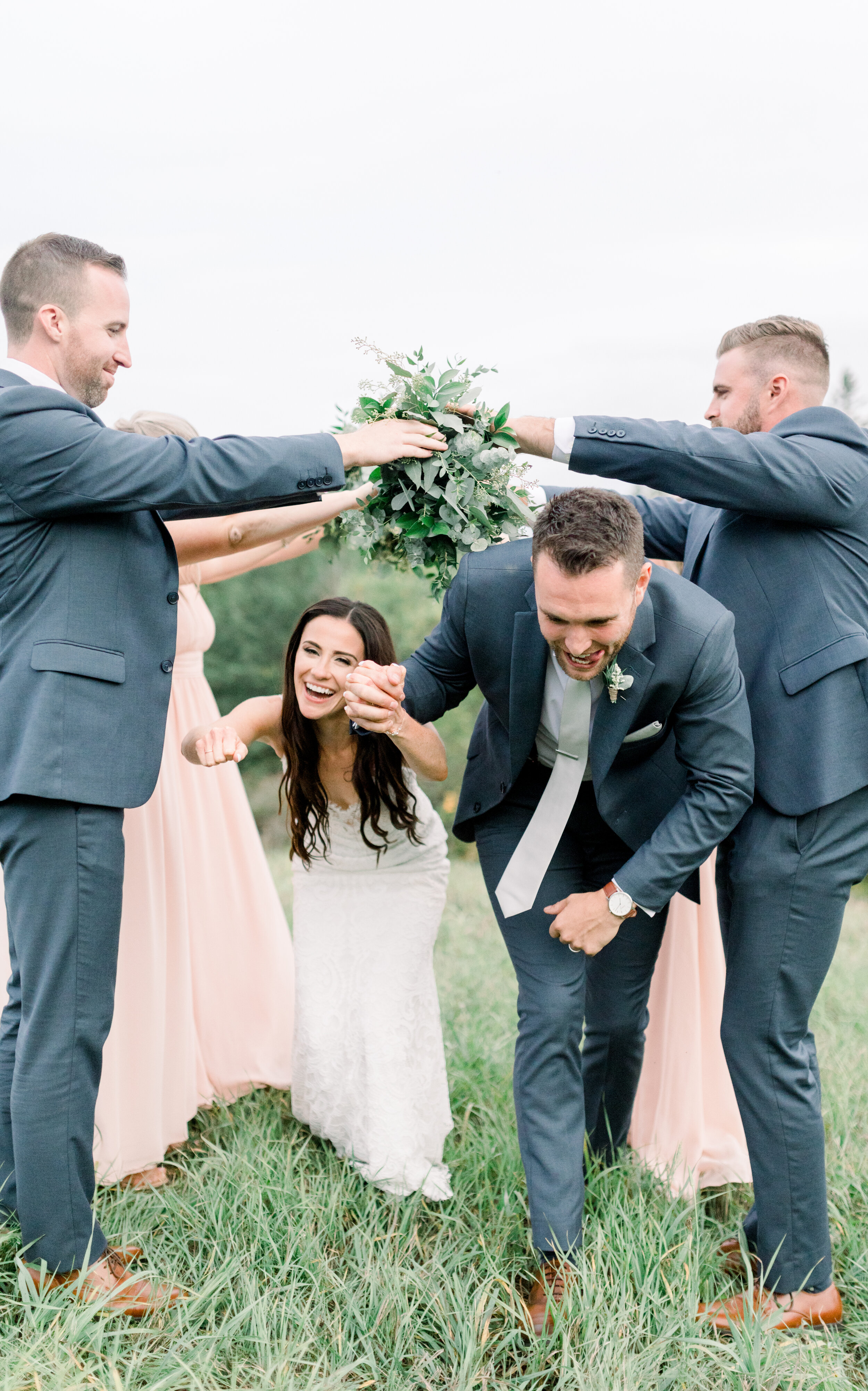  An intimate send off for the bride and groom after their wedding in Ottawa, Ontario with Chelsea Mason Photography. Send off intimate small wedding inspo wedding party tunnel celebration happy love marriage husband and wife honeymoon pink bridesmaid