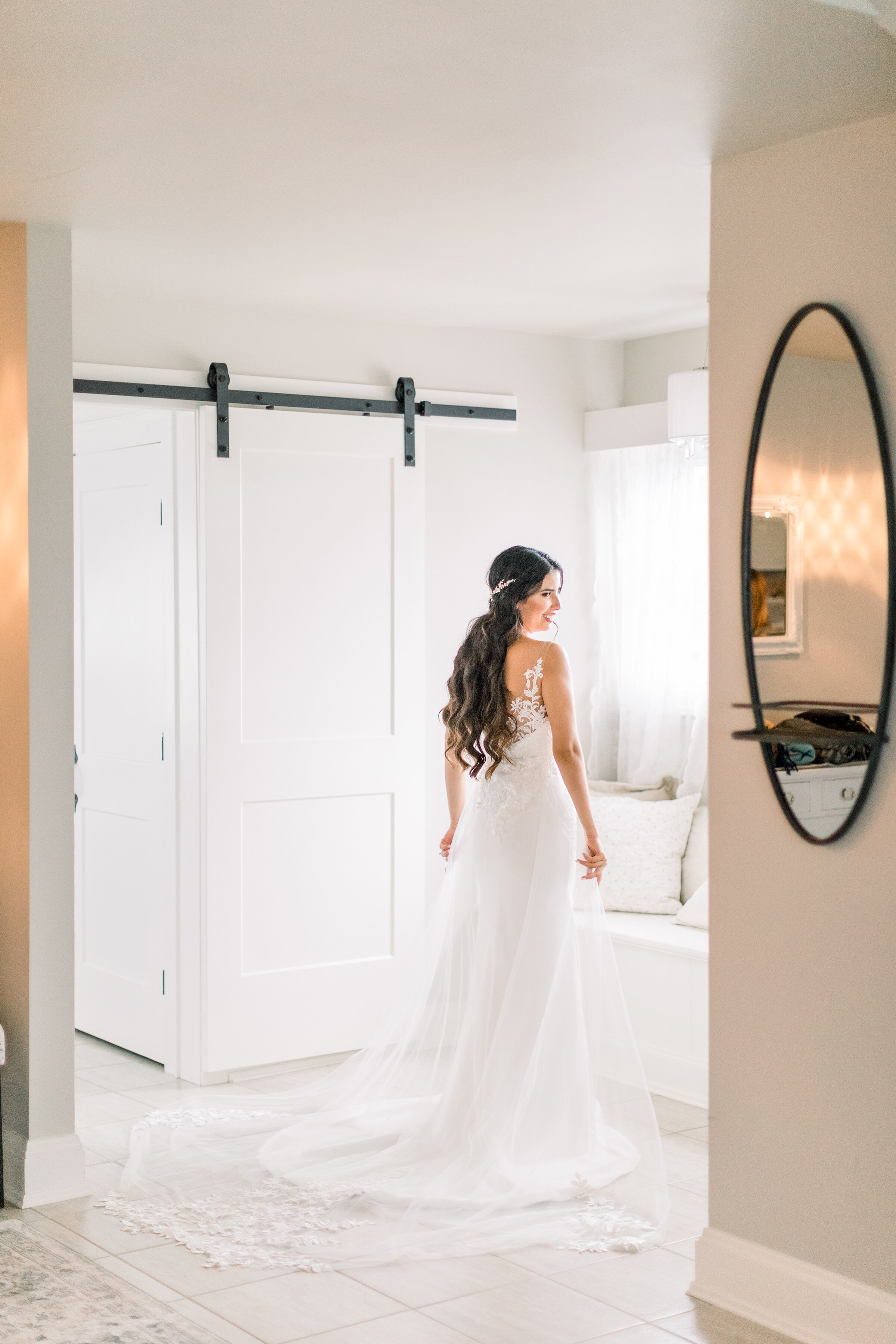  A stunning bride stands at the window in her wedding gown in a wedding styled photo shoot by Chelsea Mason Photography in Stonefields Estates, Carleton Place, Ottawa. Wedding inspiration bridal session inspiration bridal pose inspiration ideas and g