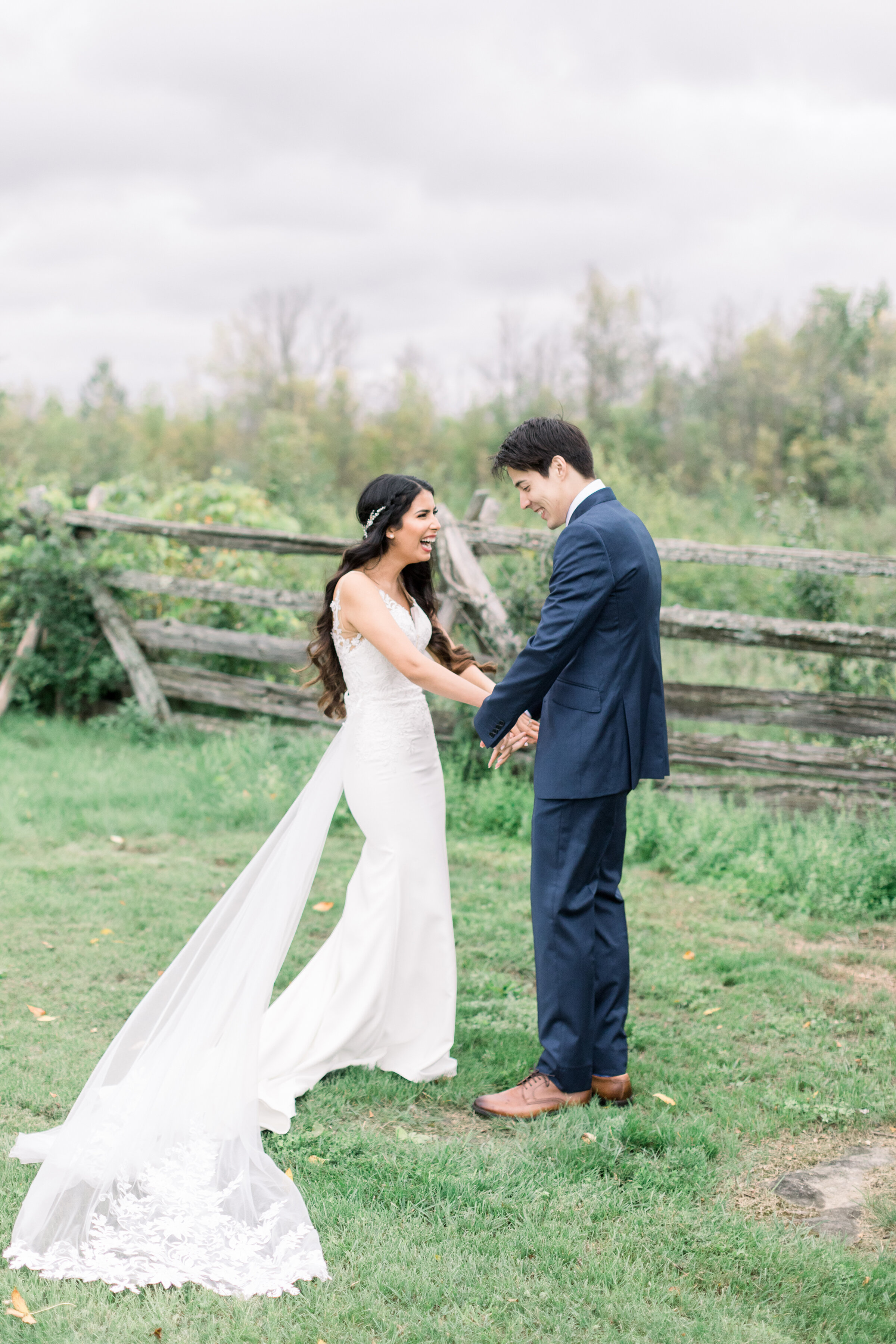  A happy couple laugh excitedly as they do the first look on the beautiful Stonefields Estates, Ottawa by Chelsea Mason Photography.  Outdoor wedding day photo shoot inspiration ideas and goals wedding location inspiration ideas and goals in Ottawa C