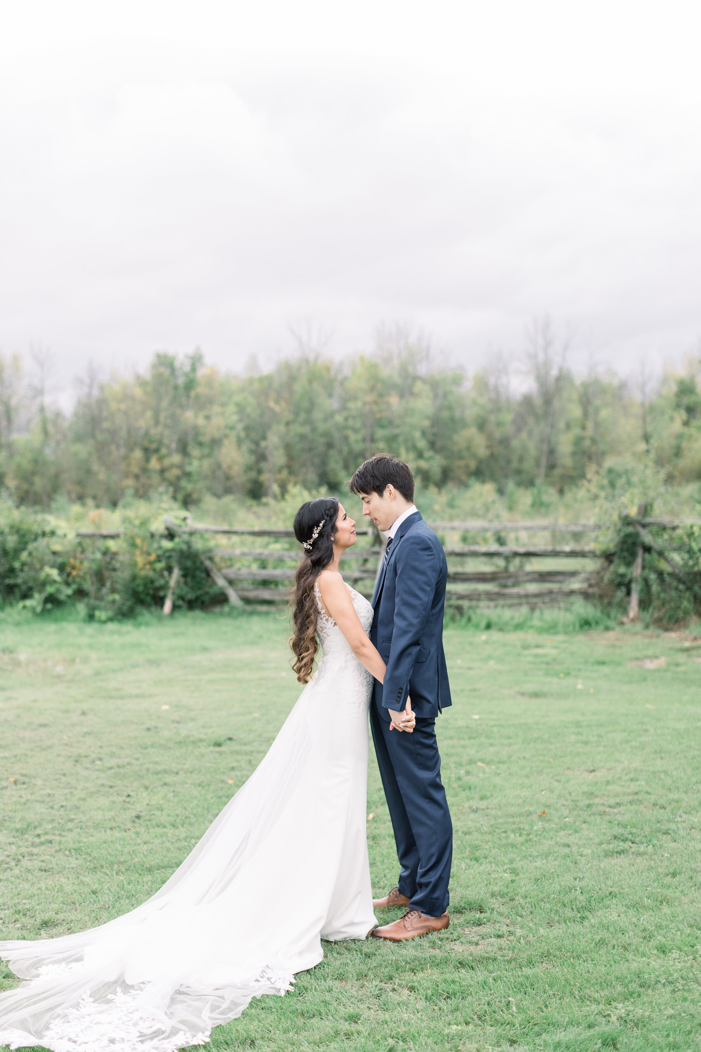  A stunning couple look into each others eyes in a dark and moody rustic wedding session in Ottawa by Chelsea Mason Photography. Stonefields Estates Carleton Place wedding location inspiration ideas and goals photo shoot location inspiration wedding 