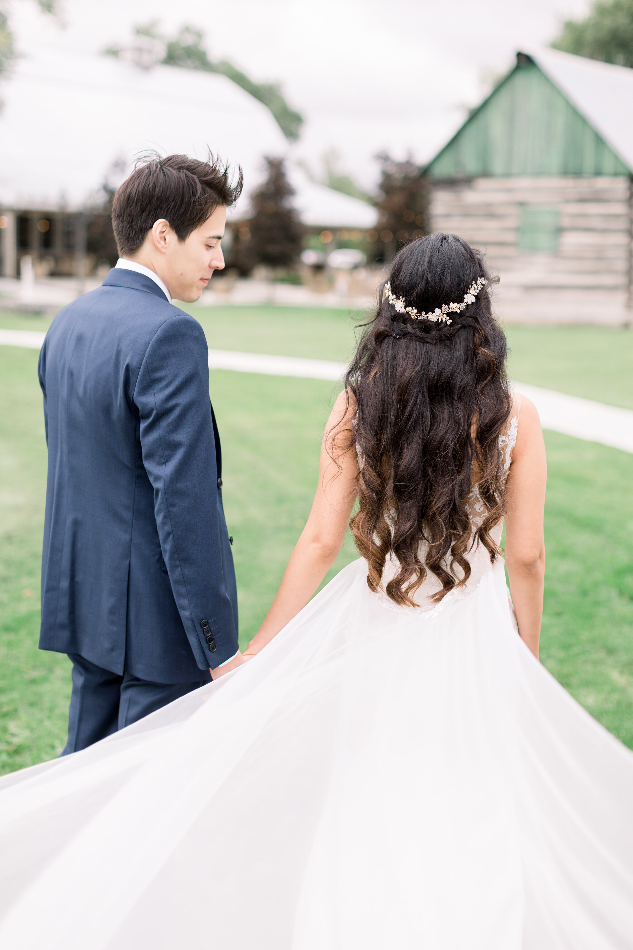  A beautiful bride and groom walk together as he checks her out in a romantic and beautiful wedding day photo shoot by professional Ottawa photographer Chelsea Mason Photography. Stonefields Estates Carleton Place wedding location inspiration rustic 