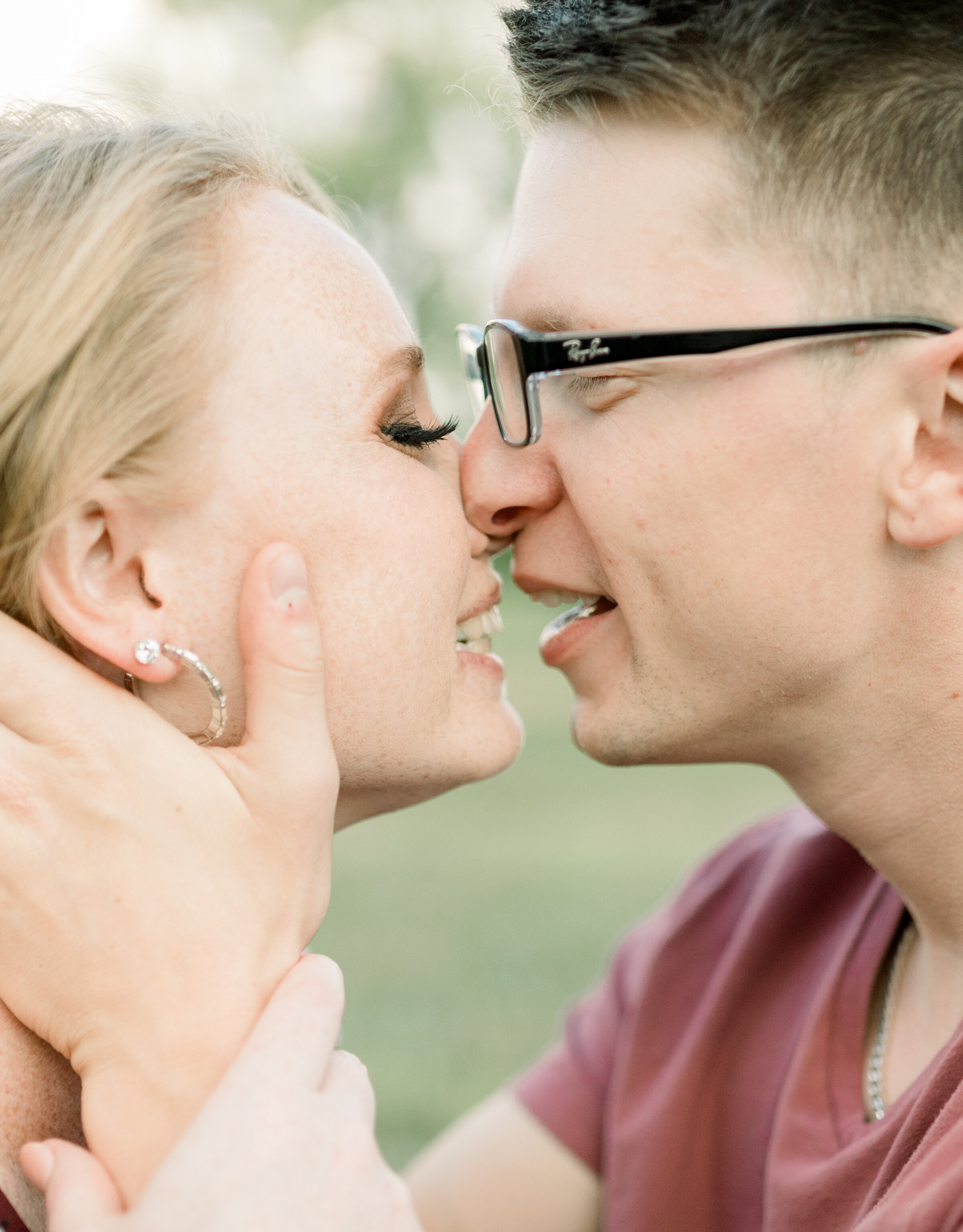  A newly engaged couple kiss each other in a beautiful engagement photo shoot at Dominion Arboretum in Ottawa by Chelsea Mason Photography, Couple goals couple kissing pose inspiration ideas and goals close up photo shoot inspiration ideas and goals 
