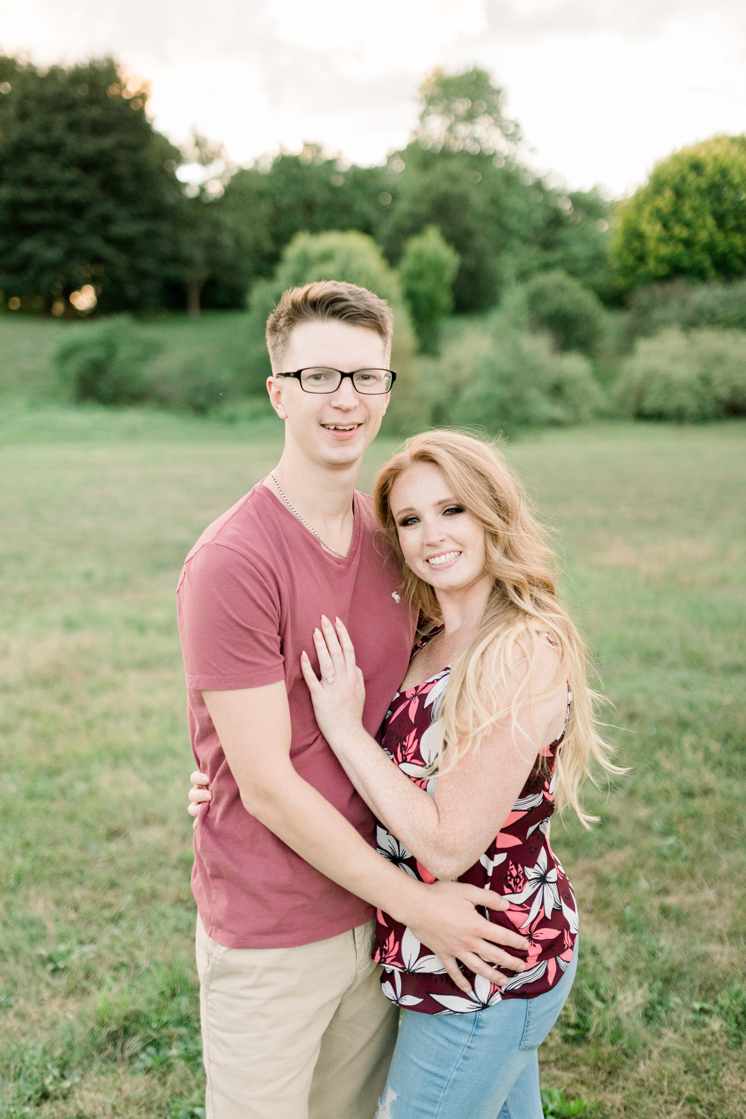  A happy couple hug each other in a romantic engagement session at Dominion Arboretum in Ottawa by a professional engagement photographer Chelsea Mason Photography. Couple goals couple pose inspiration ideas and goals romantic couple pose inspiration