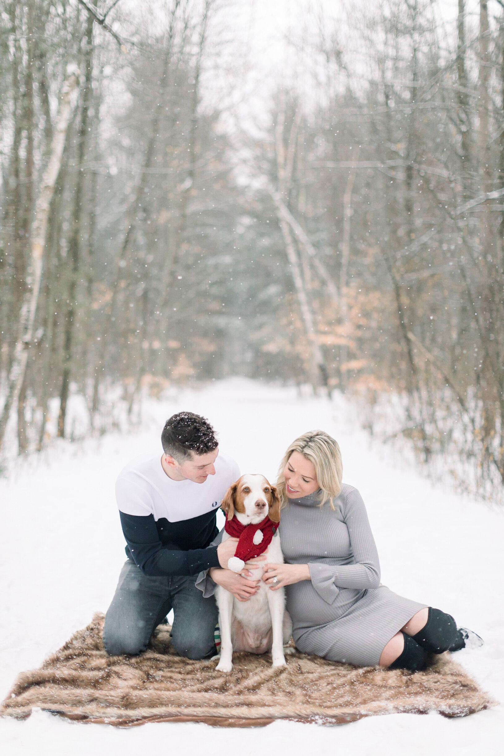  A beautiful couple sit together on a warm blanket with their adorable dog in a winter maternity session by professional Ottawa photographer Chelsea Mason Photography. Winter goals couple goals couple pose inspiration ideas and goals Pinhey’s Trail o