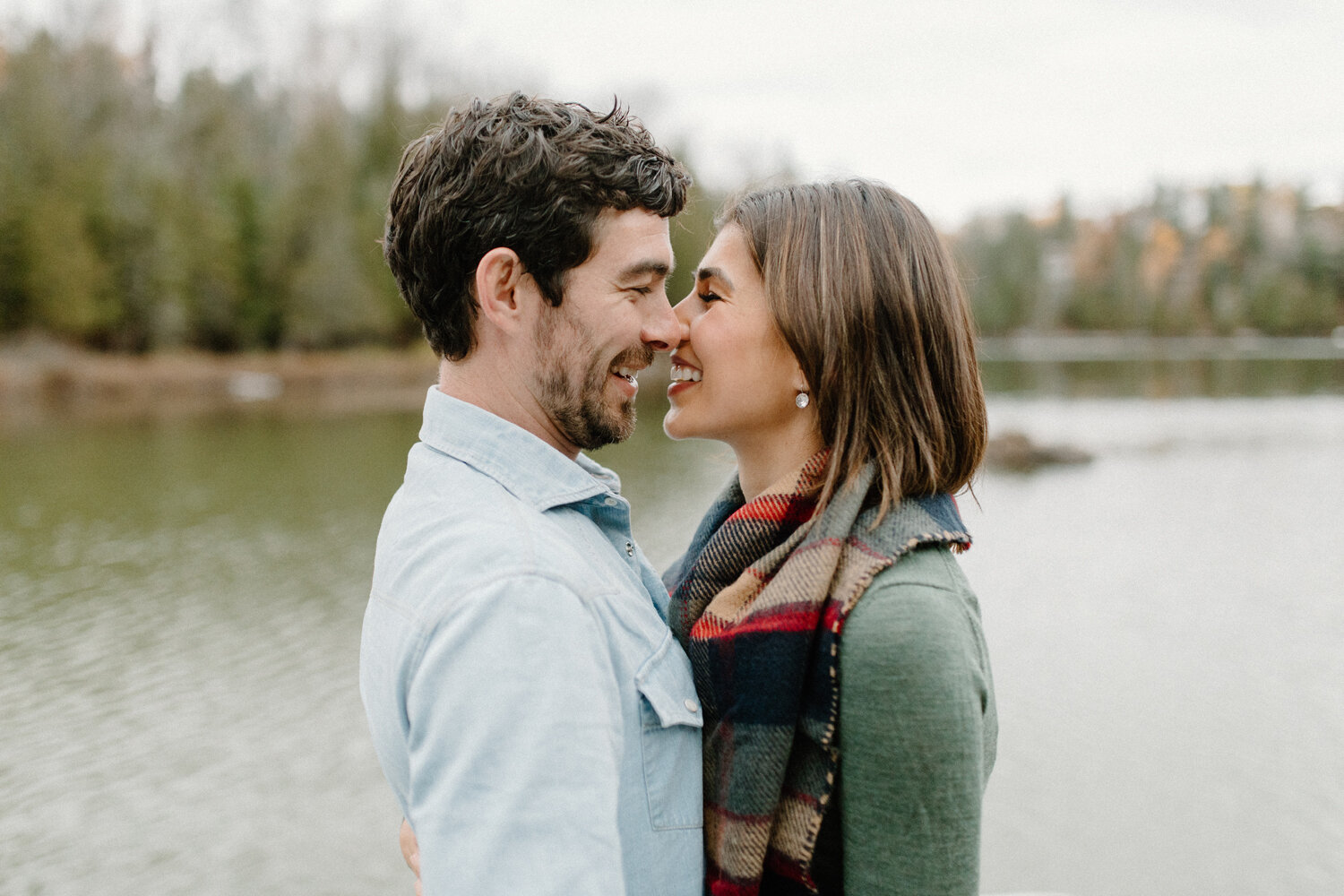  Smiling and leaning in for a kiss, Chelsea Mason Photography captures this engaged couple during their autumn couples photoshoot in Quebec, Canada. Autumn quebec canada engagement session photographer ottawa canada, casual autumn engagement outfit i