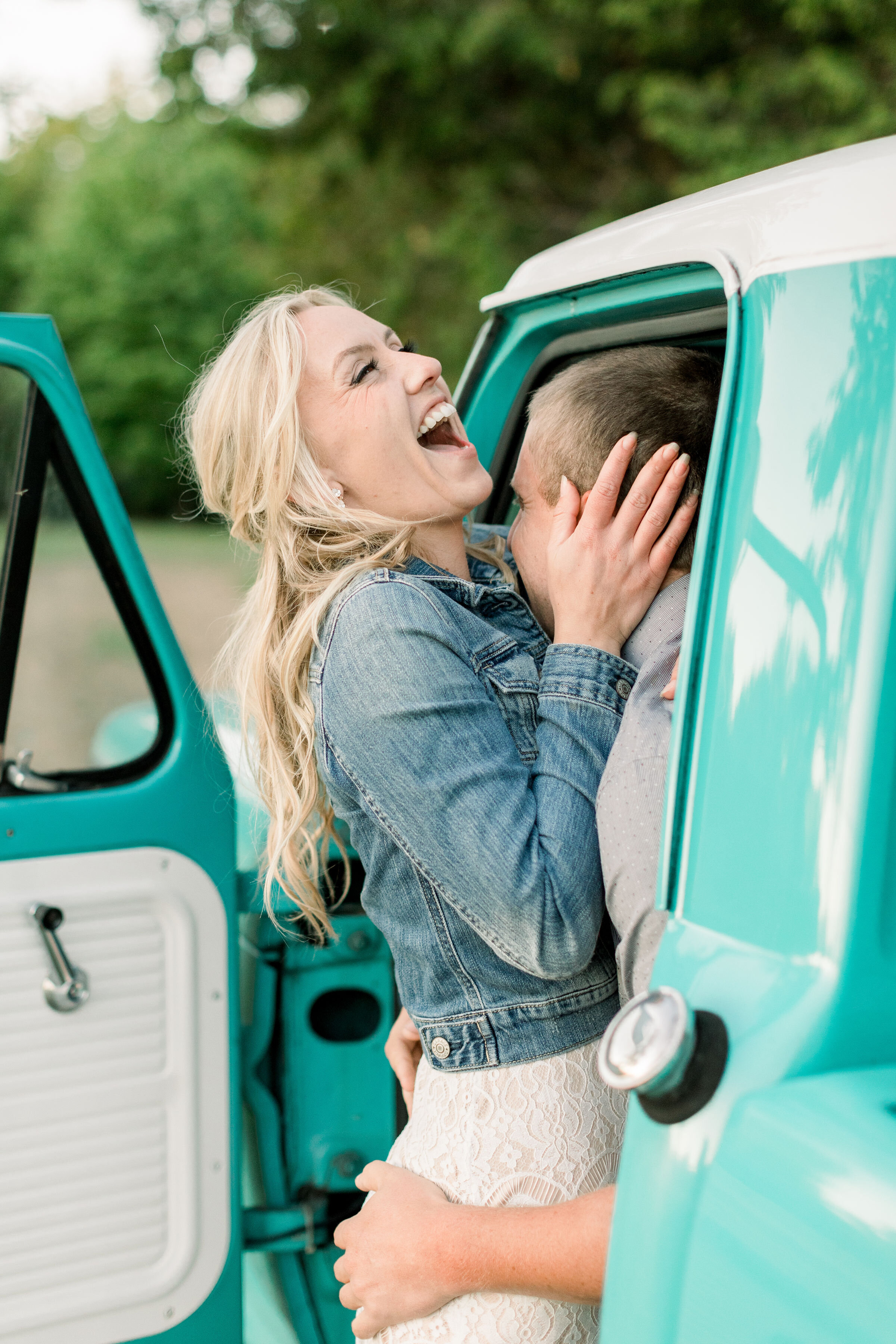 While leaning against this vintage Tiffany Blue pickup truck, Ottawa, Ontario couples photographer, Chelsea Mason Photography captures this couple playfully embracing. women's denim jacket with white lace maxi dress Ottawa Canada photographer #Chels