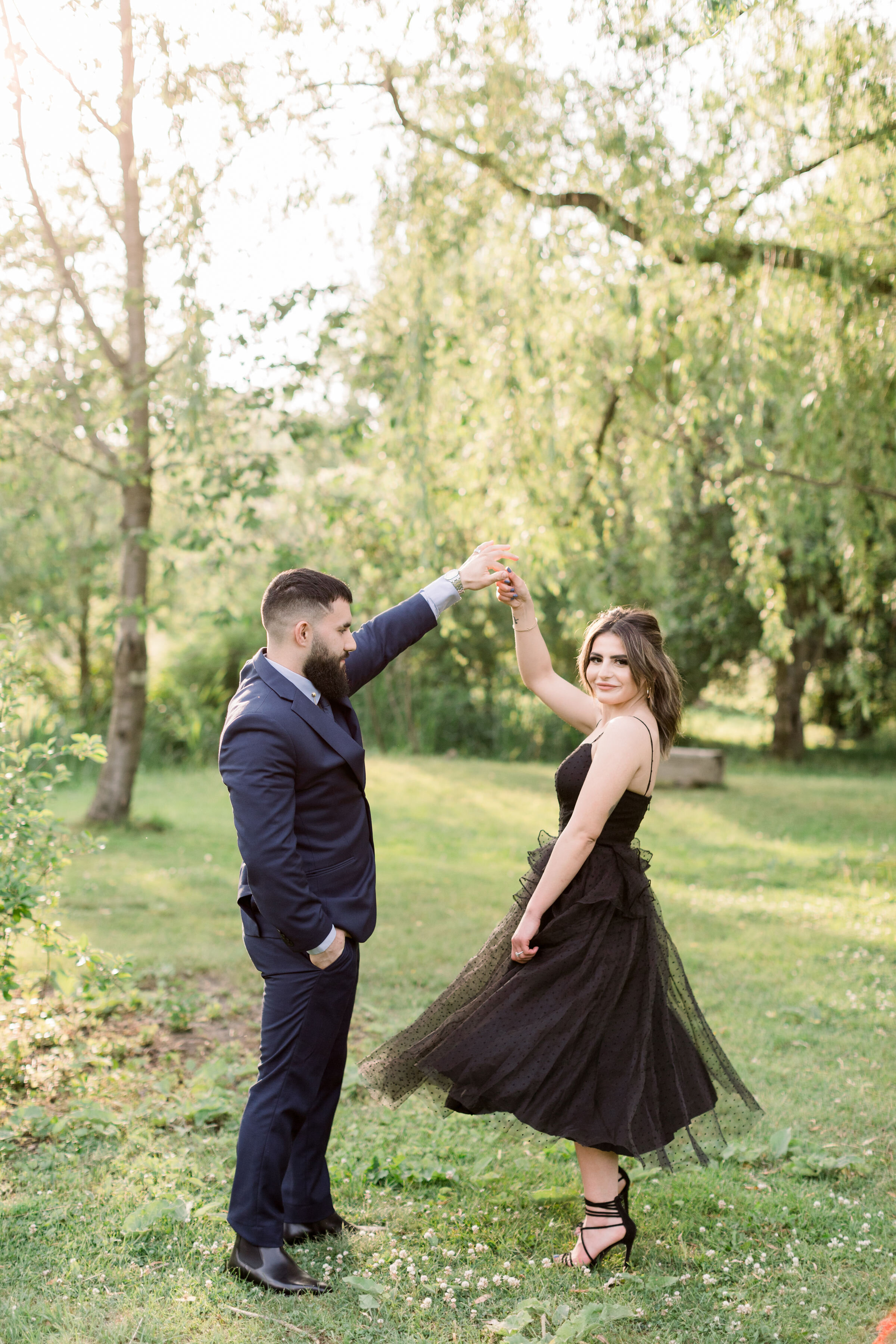  During this formal engagement shoot in Ottawa, Ontario, Chelsea Mason Photography captures this soon-to-be groom twirl his fiancé. twirling dancing engagement formal session Ottawa Ontario couples photographer #ChelseaMasonPhotography #OttawaOntario
