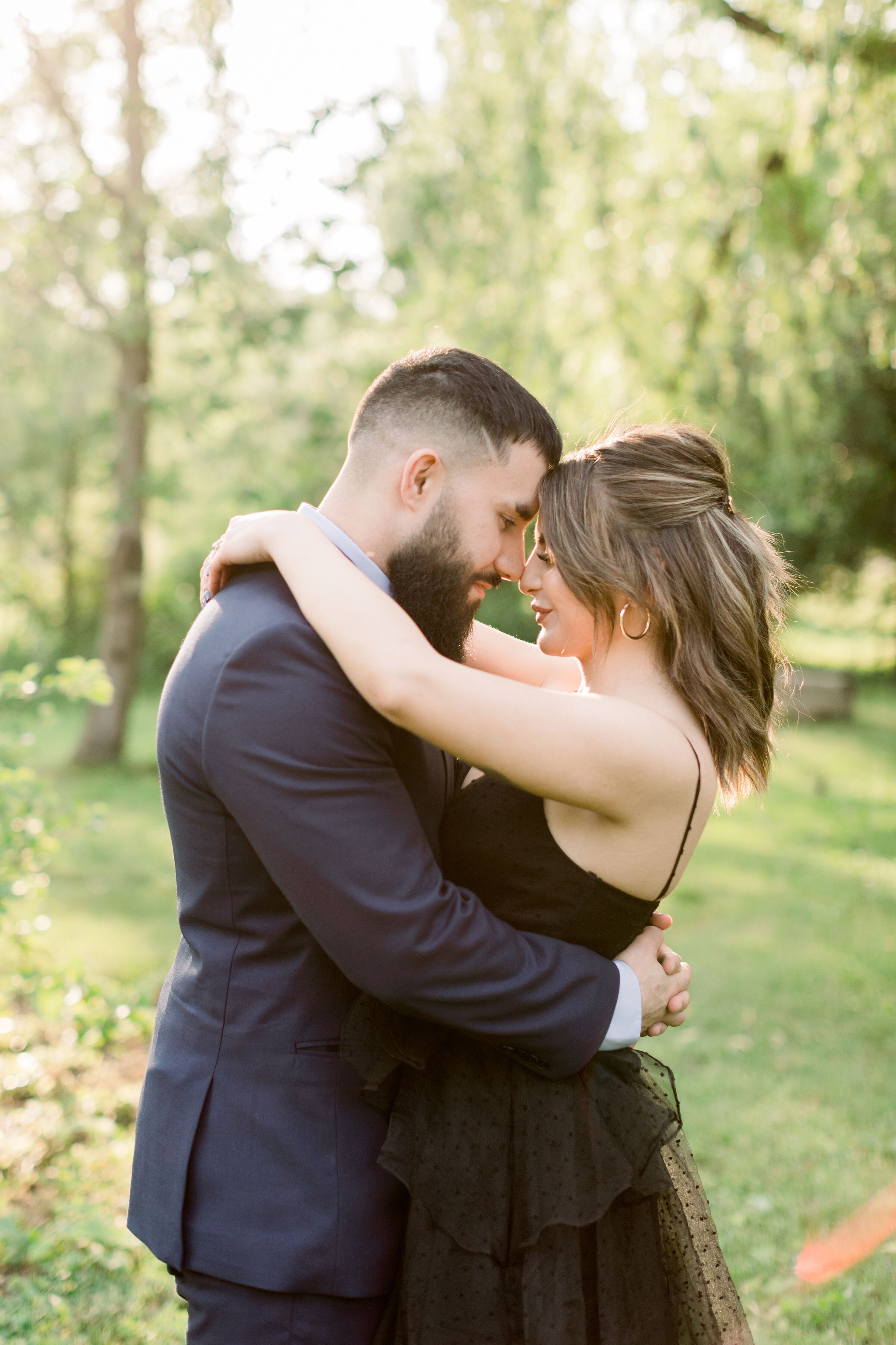  Holding one another close and pressing foreheads together, Ottawa, Ontario photographer, Chelsea Mason Photography captures this couple for their engagement session. couple pressing foreheads together formal engagement outfits Ottawa photographer #C