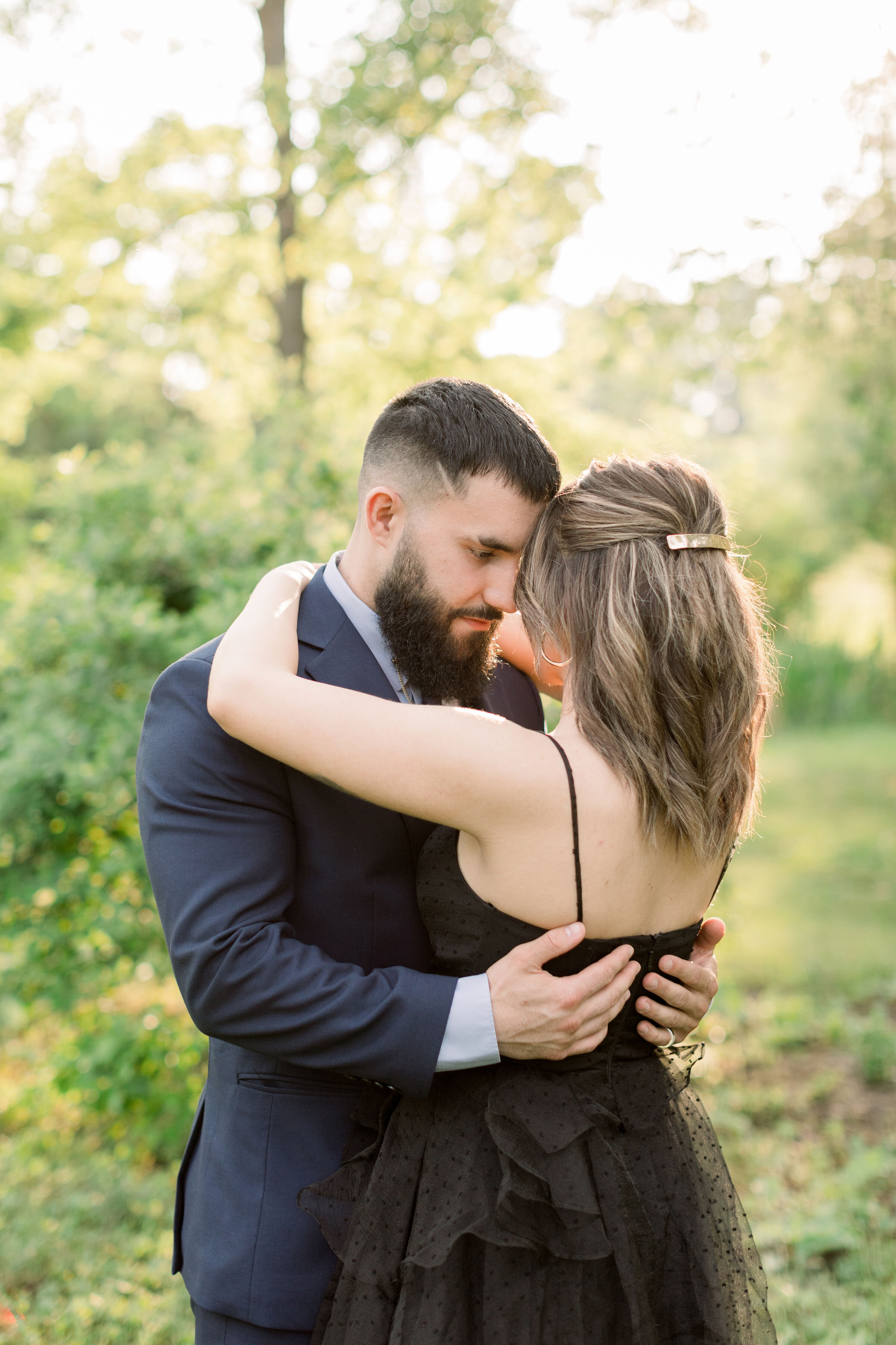  Chelsea Mason Photography captures this Ottawa, Ontario couple romantically pressing their foreheads together while looking into one another's eyes. couple pressing foreheads together women's shoulder length hair with gold Barrett Ottawa photographe
