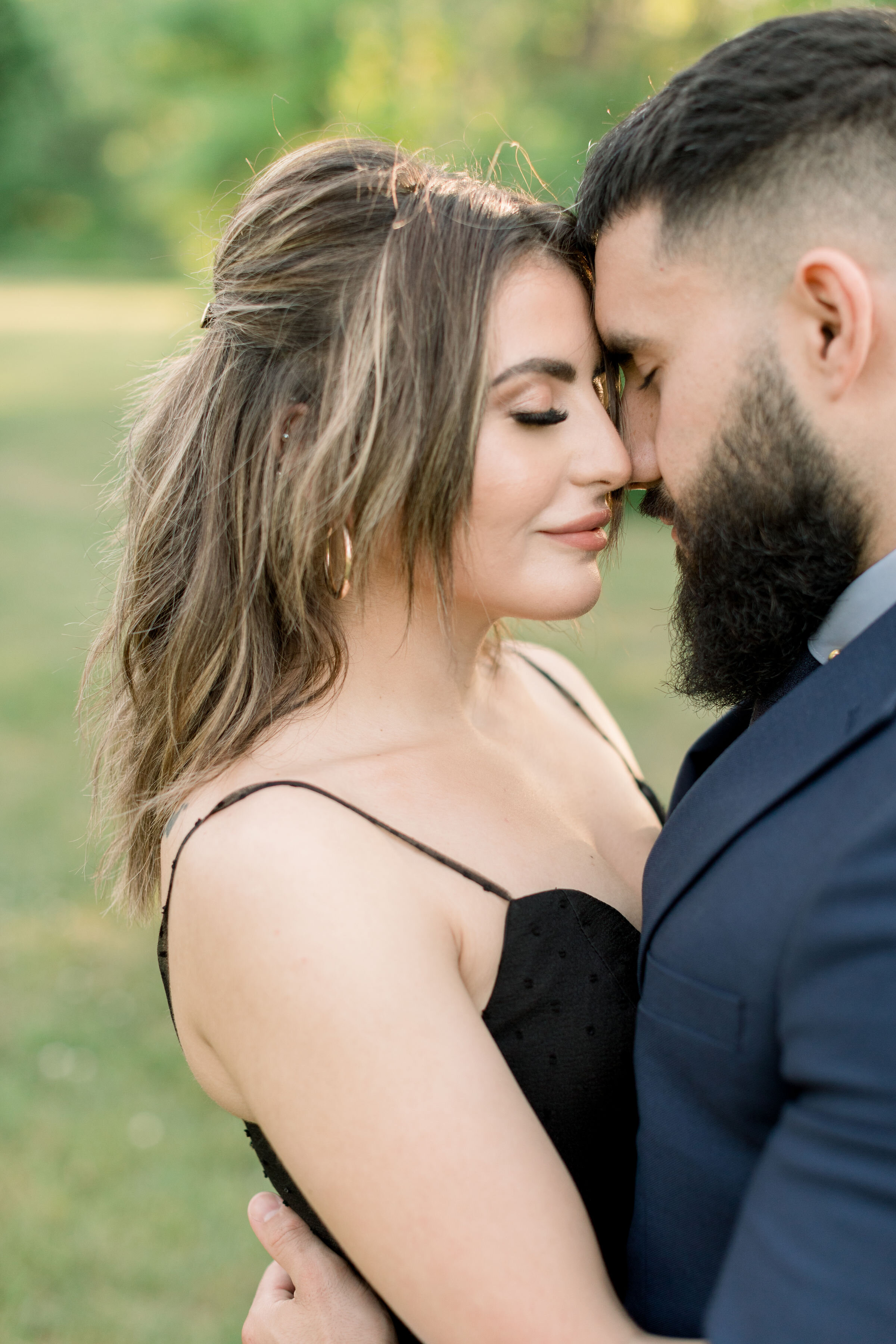  Embracing her fiance, Ottawa, Ontario photographer, Chelsea Mason Photography captures this couple pressing their foreheads together during this engagement session. couple romantically pressing foreheads together with eyes closed couples photography