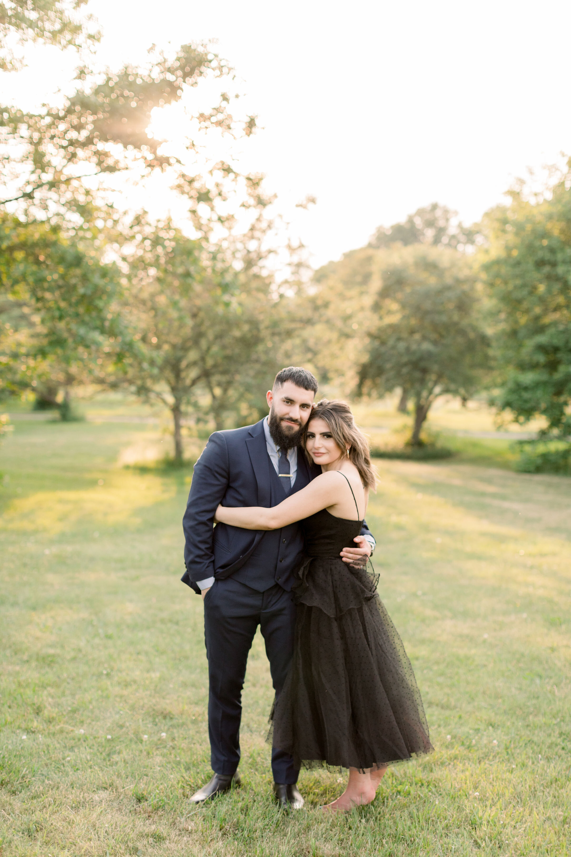  During this park engagement session in Ottawa, Canada, Chelsea Mason photography captures this formally dressed engaged couple lovingly embracing during this session. engaged couple embracing poses Ottawa Ontario couples photographer #ChelseaMasonPh