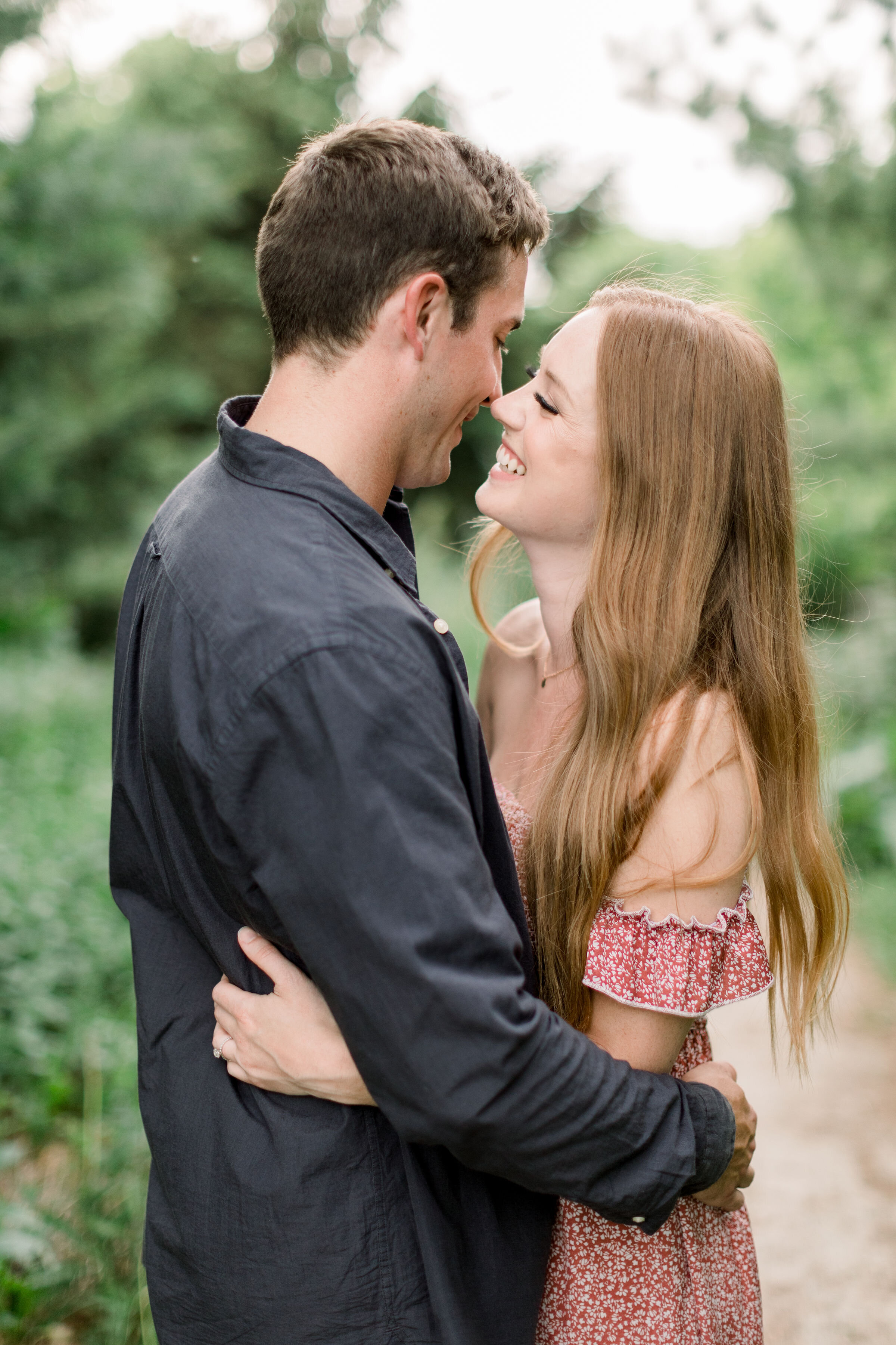  Arboretum, Ottawa photographer, Chelsea Mason Photography captures this couple holding one another close romantically in a wooded clearing during their engagement session. photo locations arboretum Ottawa photographer engagement poses and outfits #C