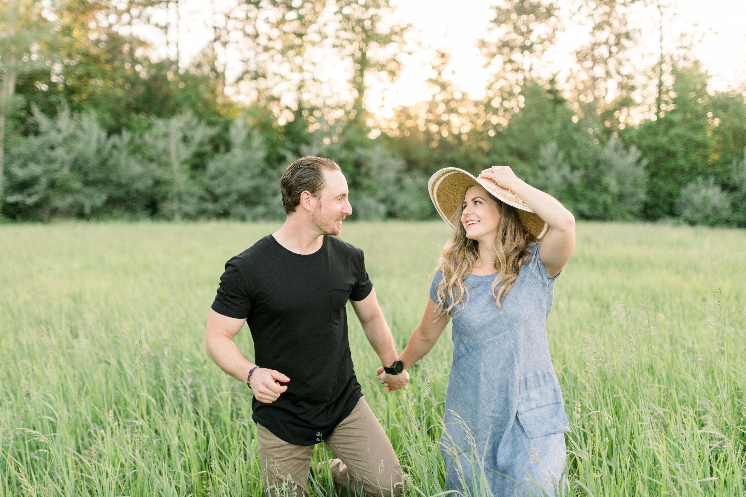  Engagement portrait with a woman wearing floppy sunhat in the mountain by Chelsea Mason Photography. floppy sunhat mountain #chelseamasonphotography #chelseamasonengagements #Ottawaengagments #Almonteengagementphotographer #outdoorengagments 