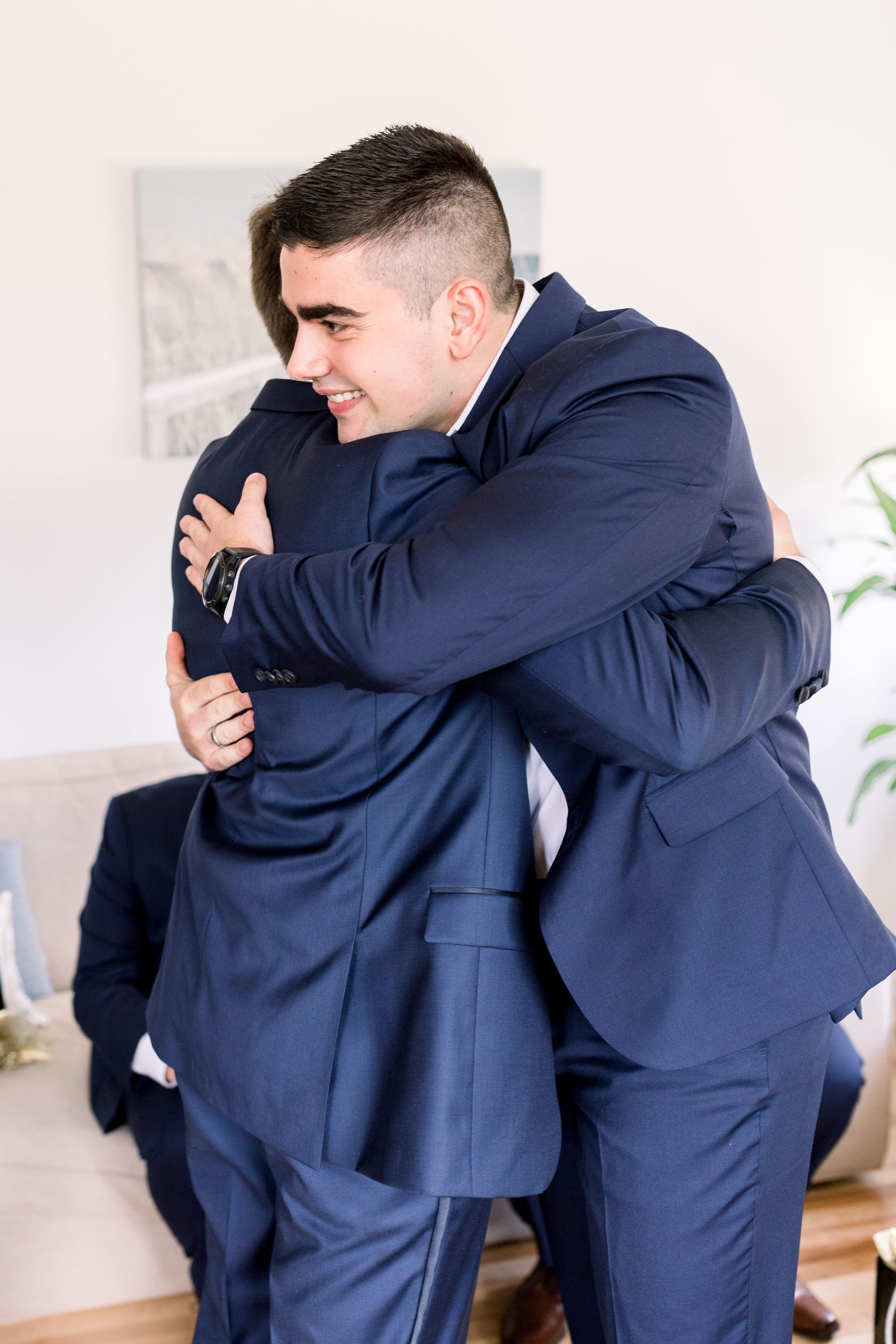  A groom hugs the best man before the wedding by Chelsea Mason PHotography in Almonte, Ontario. best man and groom blue suits #Chelseamasonphotography #Chelseamasonweddings #Onatarioweddings #EvermoreweddingsAlmonte #Ontarioweddingphotographers 