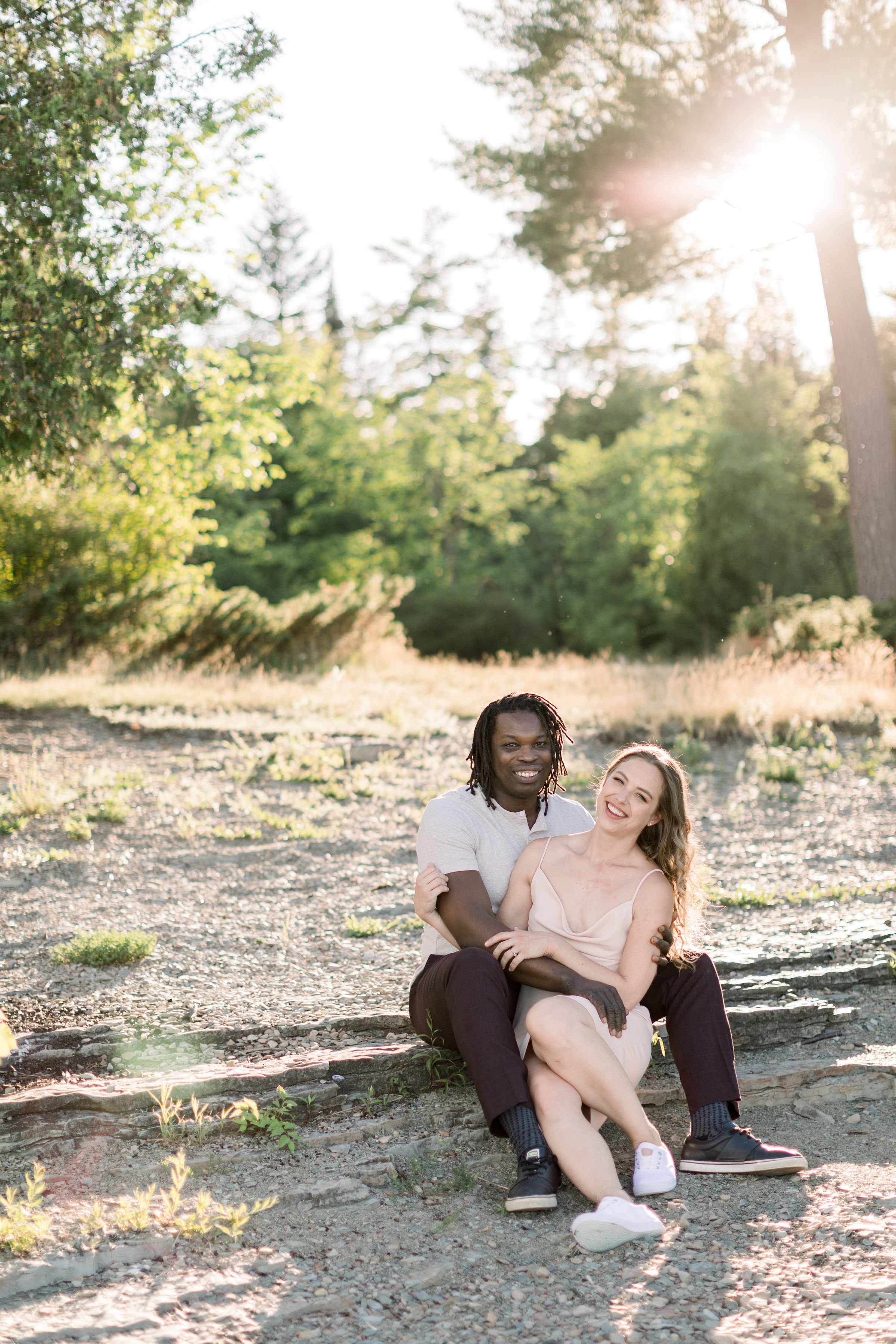  With golden sunburst behind them, a couple smile for engagements with Chelsea mason Photography in Ontario. engagement portrait #Chelseamasonphotography #Chelseamasonengagements #Onatarioengagements #Pinhey'sPoint #Ontarioweddingphotographers 