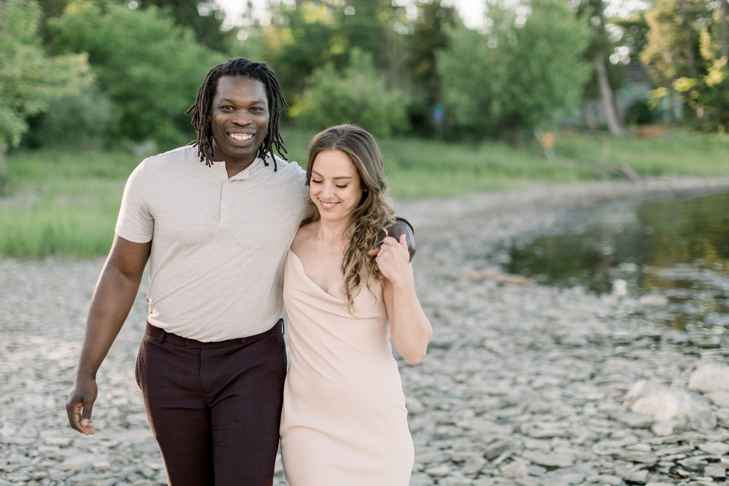  A portrait of an engaged couple where a man is smiling and looking forward was captured by Chelsea Mason Photography. man smiles #Chelseamasonphotography #Chelseamasonengagements #Onatarioengagements #Pinhey'sPoint #Ontarioweddingphotographers 