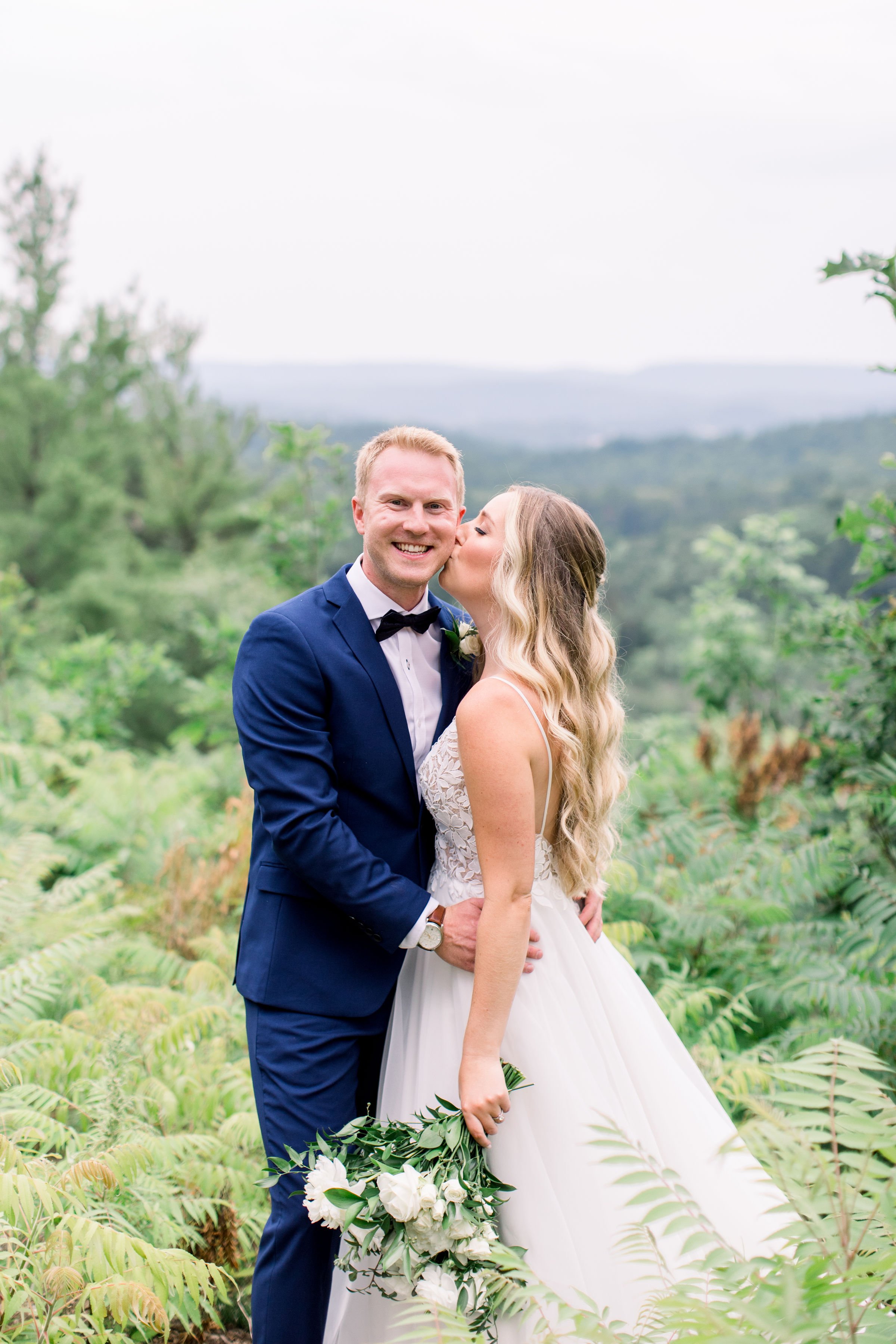  Bride kisses the groom's cheek on their wedding day by Chelsea Mason Photography a Quebec photographer. classy wedding styles #Quebecweddings #elegantoutdoorwedding #Quebecweddingphotographers #Chelseamasonphotography #Chelseamasonweddings 