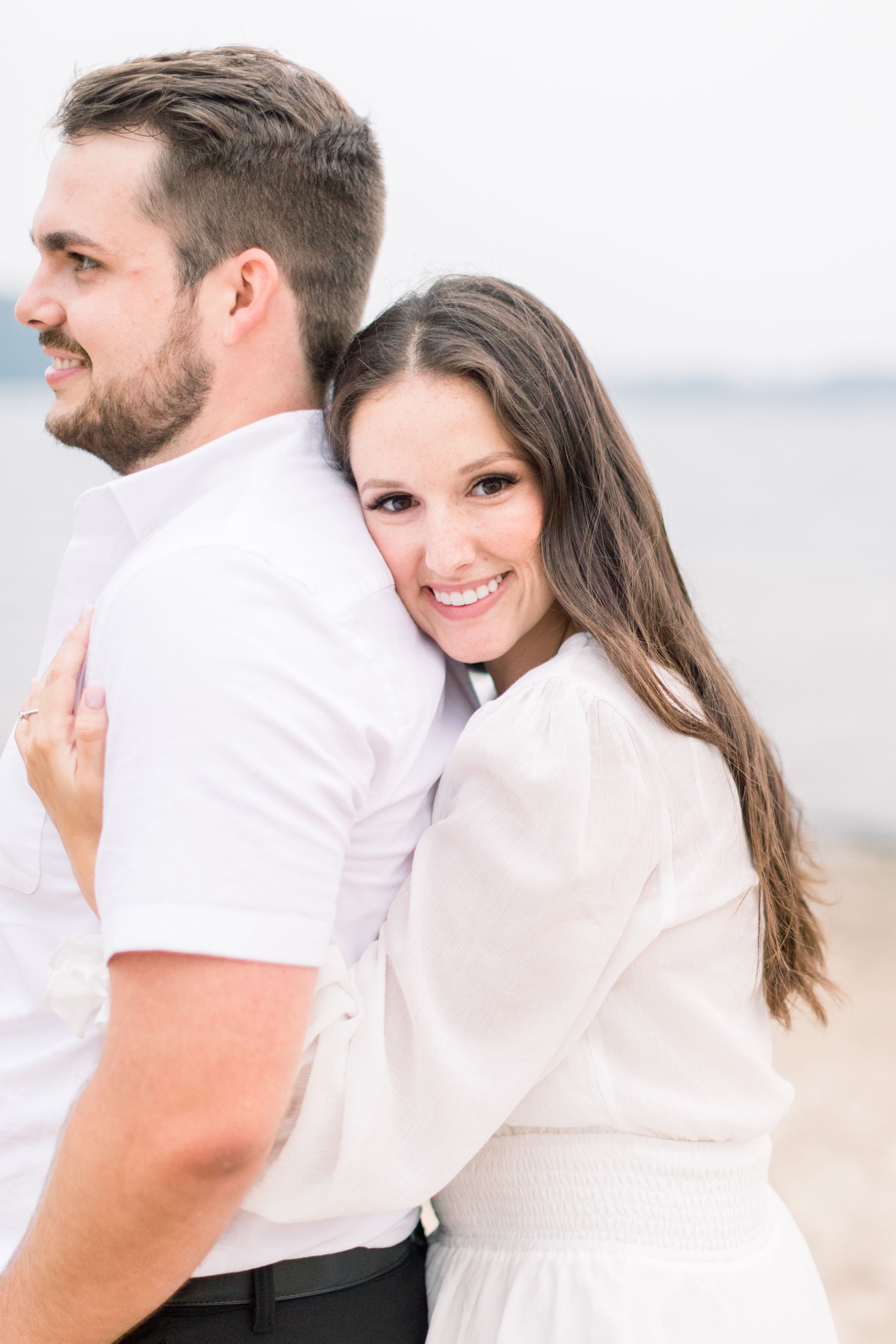 Portrait of a woman hugging a man from behind captured by Chelsea Mason Photography. professional engagements Kingston #Kingstonengagement #GrassCreekParkPortraits #Ontarioengagementphotographers #Chelseamasonphotography #Chelseamasonengagements 